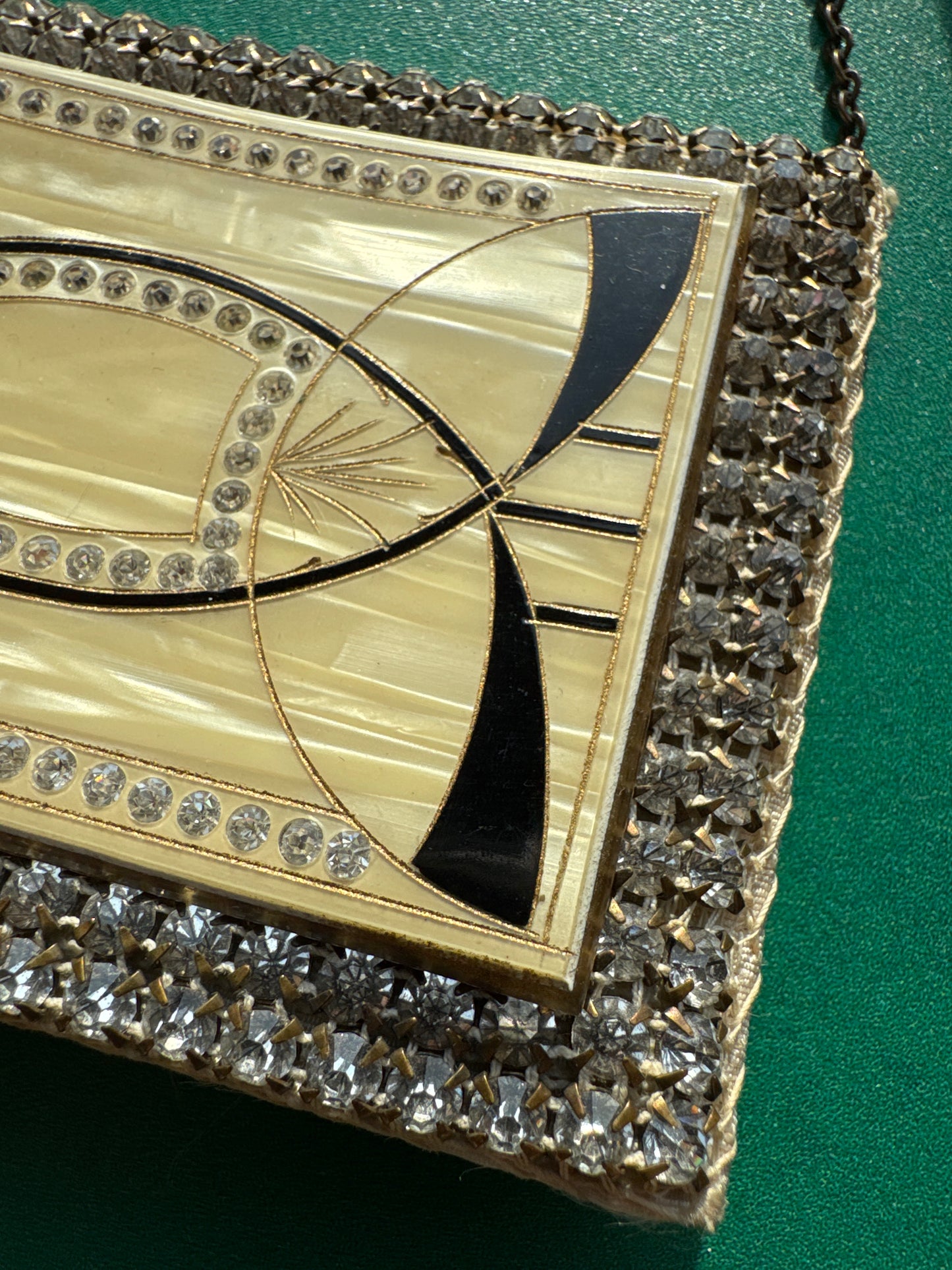 Beautiful rhinestone and enamel art deco 1920s modernist mini minaudiere with chain. Celluloid with geometric in layers, give it the jazz age glamour. Over 100 years old!