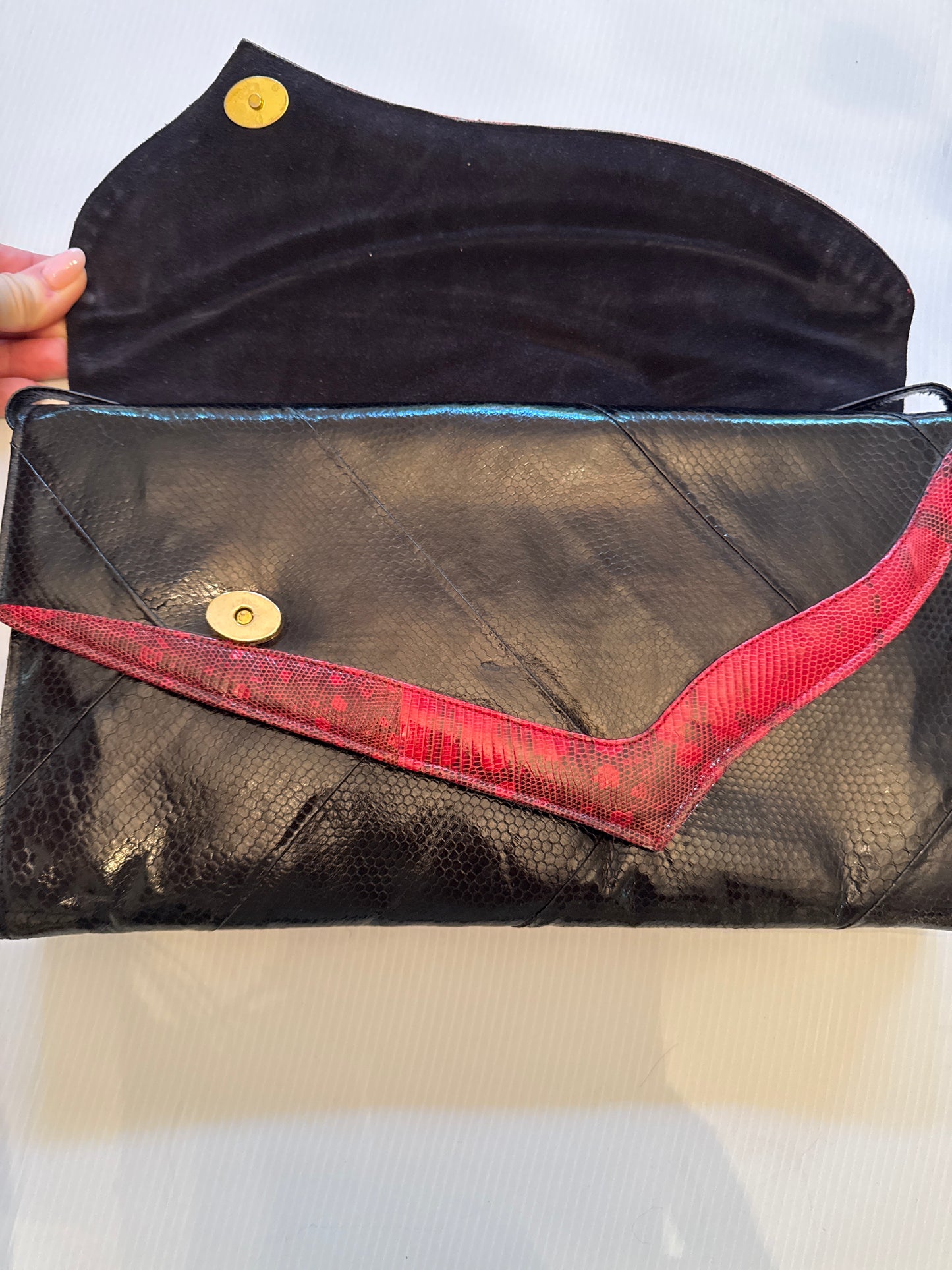 Absolutely, stunning, vintage snake skin clutch with optional shoulder strap in black and burgundy with two roomy compartments. Each compartment has its own zipper and small pocket