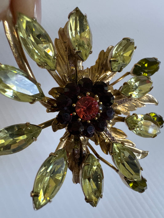 Exquisite signed Graziano, gold tone brooch with green purple and pink rhinestones