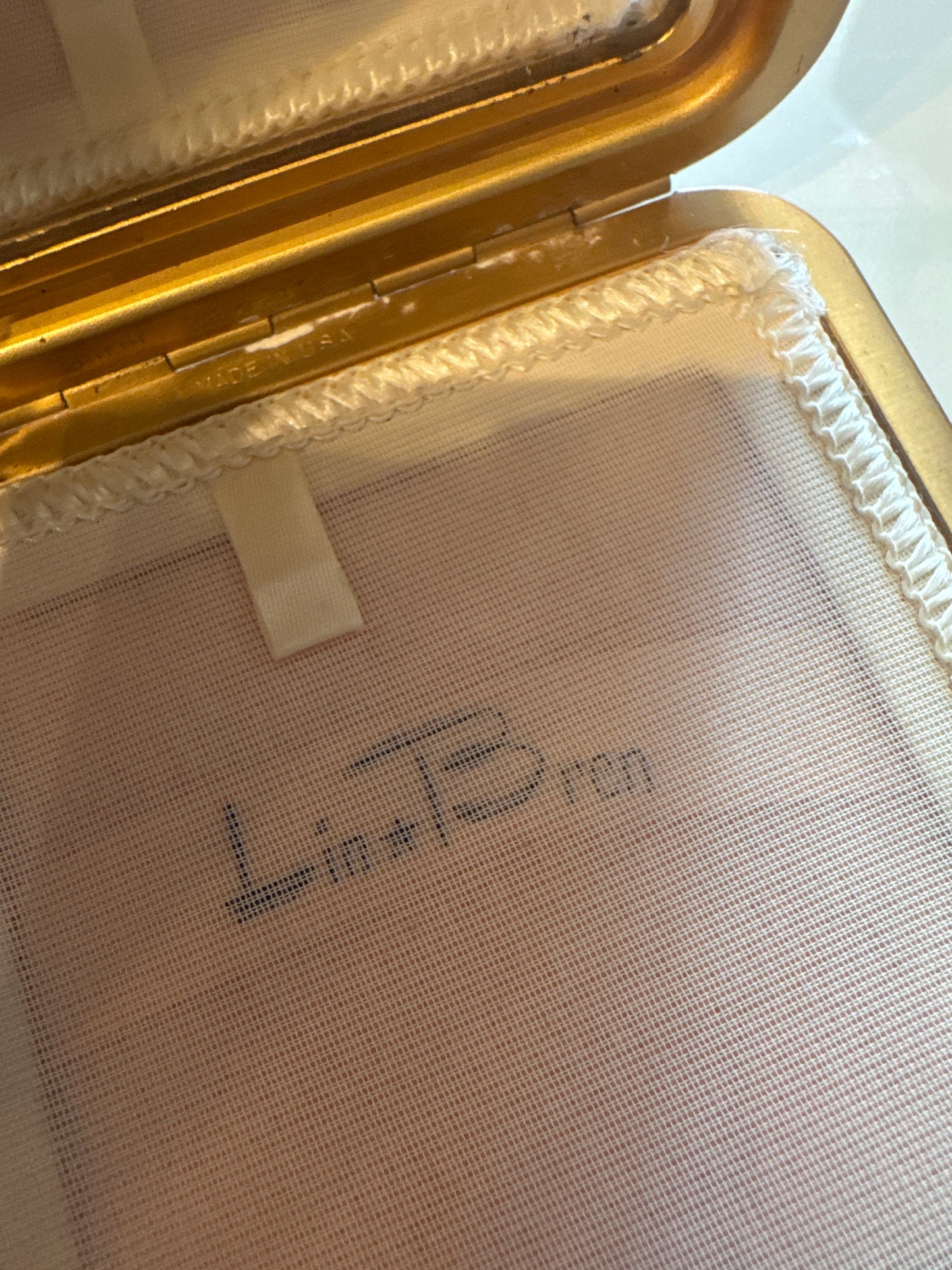 Beautiful brocade, Makeup, compact and coin purse with slide lock. Designed in the 1950s by LIN BREN.