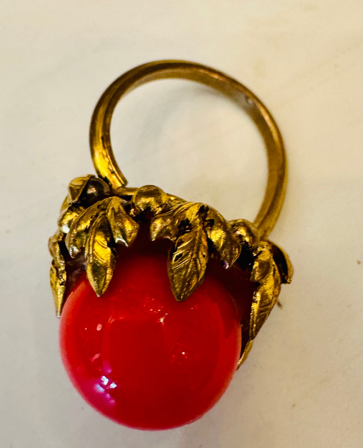 1960s gold tone leaf motif with red "gumball" stone