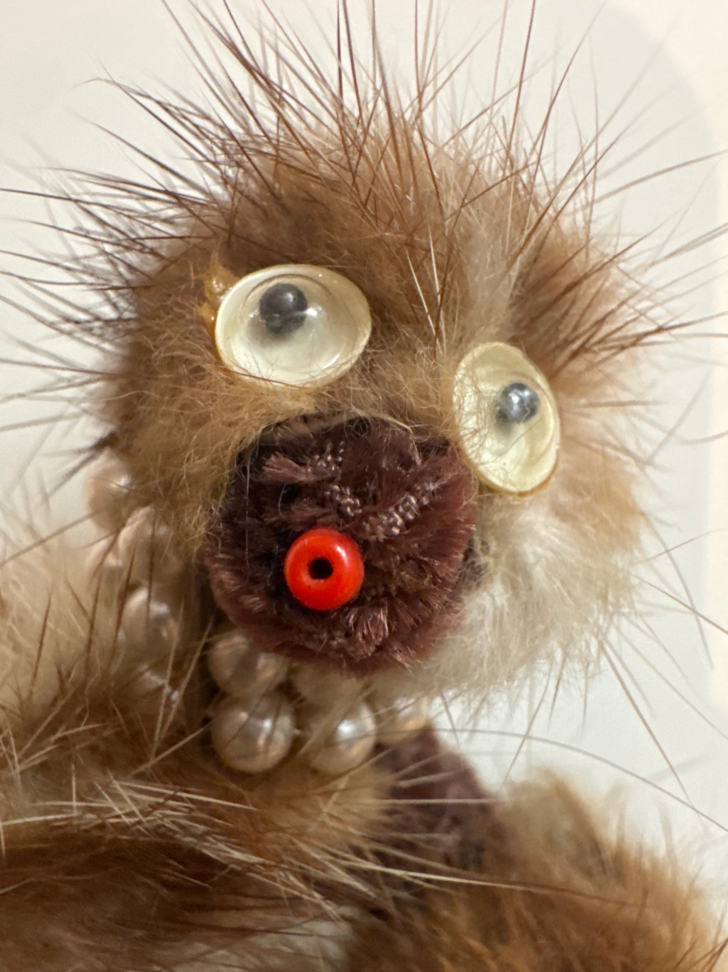 Late 1940s mink doggie brooch with googly eyes and pearl necklace
