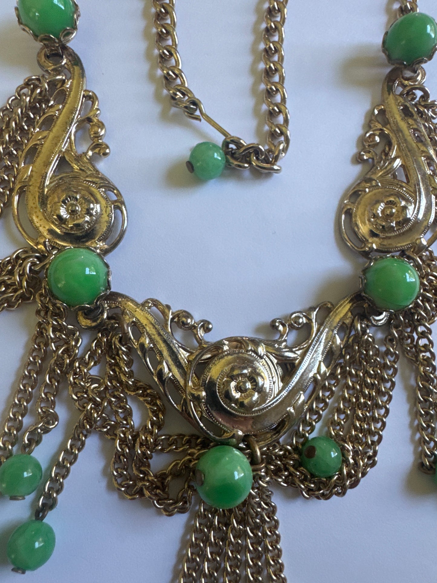 1960s/70 signed "NAP" NAPIER necklace with greene CABACHON stones and a paisley like filagree gold tone design