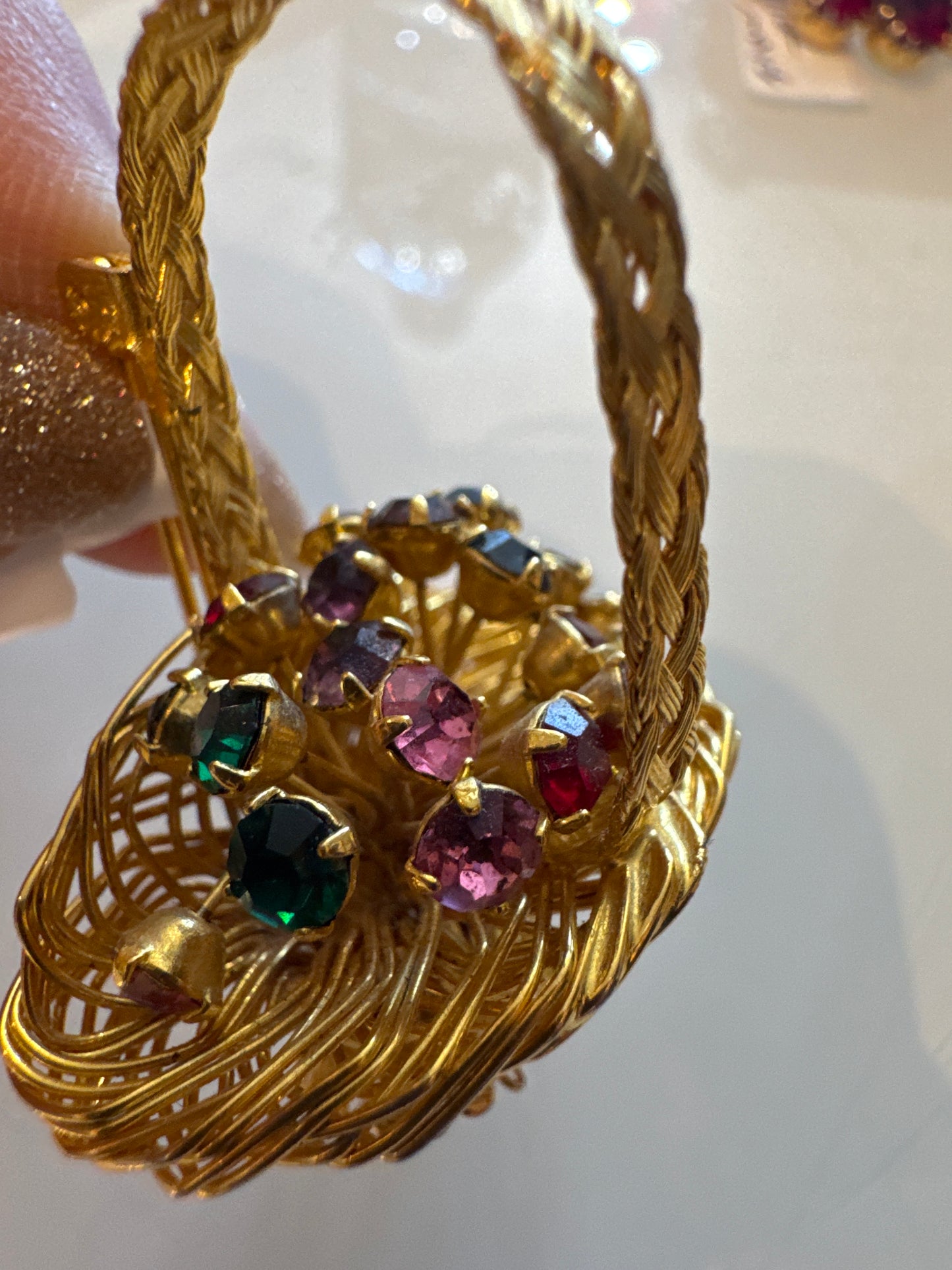 Adorable 3-D flower basket with braided handle and colorful rhinestones