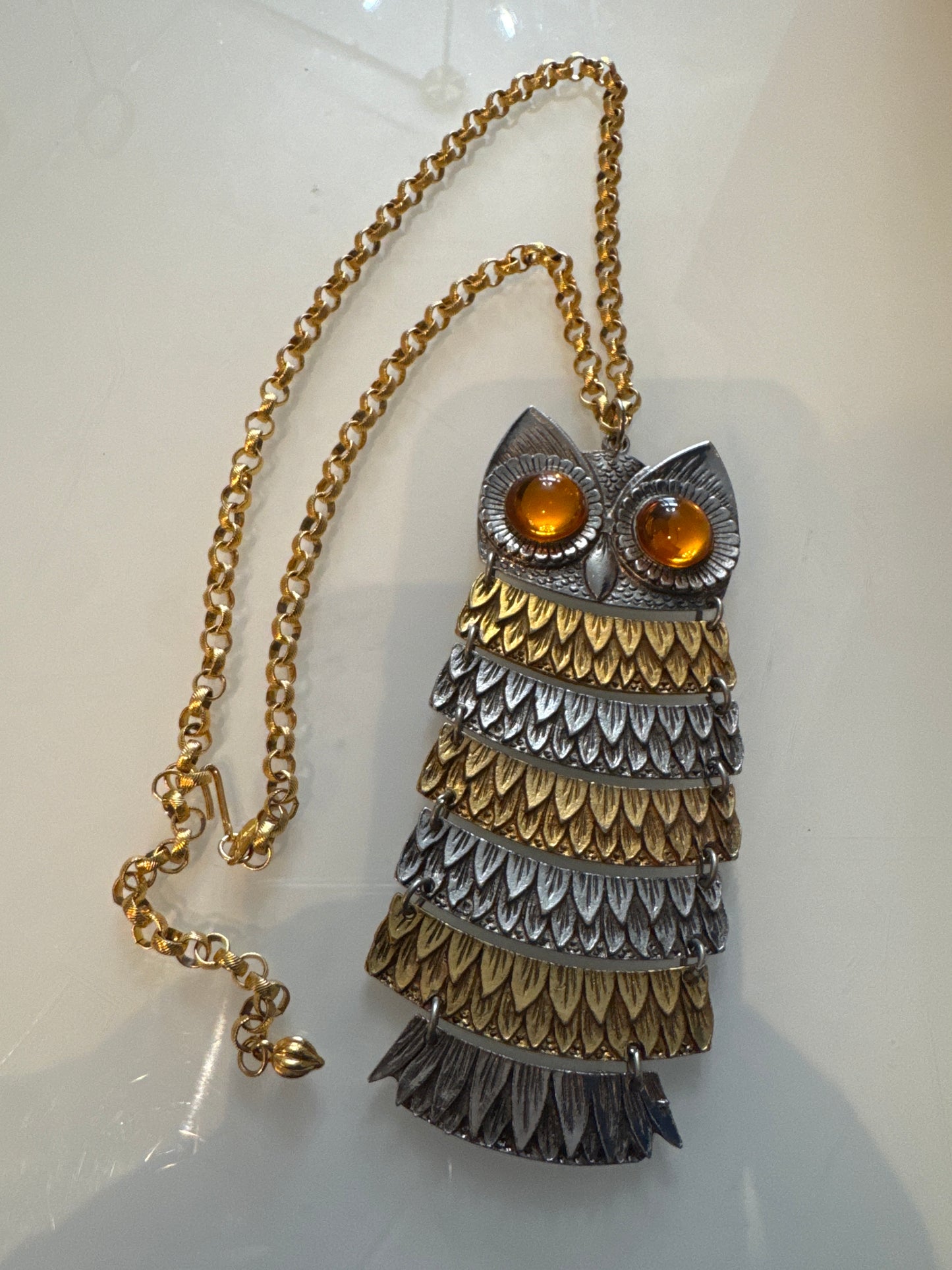 Vintage signed Park Lane  articulated owl pendant necklace from the 1970s in gold and silver with cabachon amber eyes