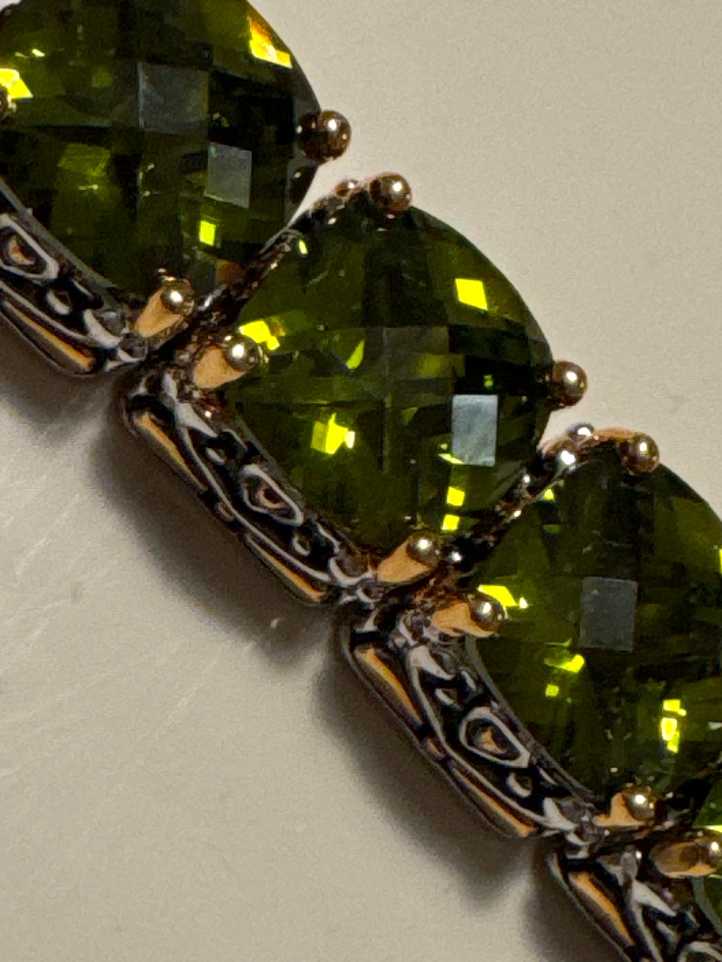Beautiful, signed Park Lane bracelet olive colored rhinestones on a silver rhodium and gold to base grade measure 7 inches