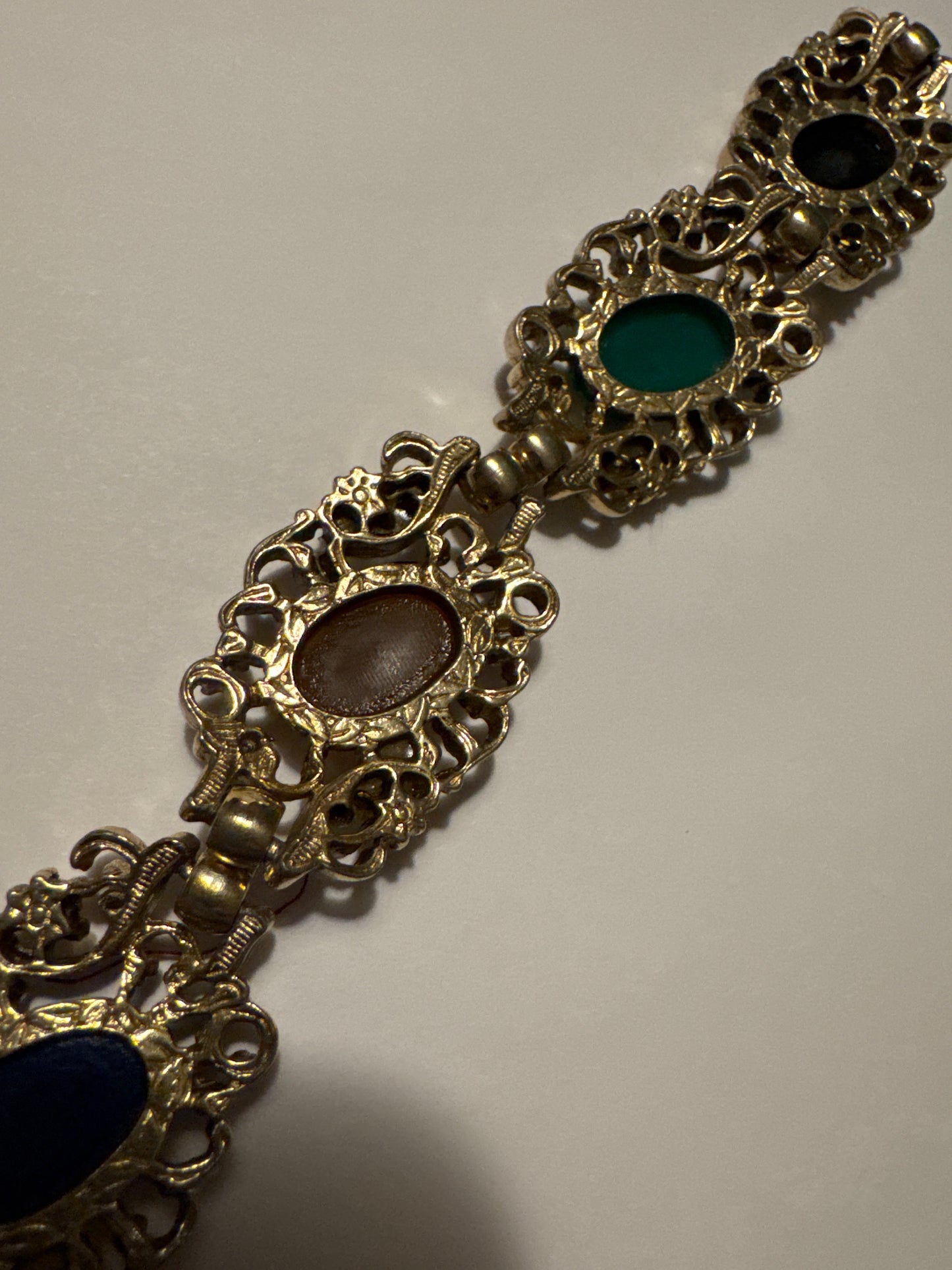 1970s gold tone bracelet with colored cabochons and faux pearls. Road