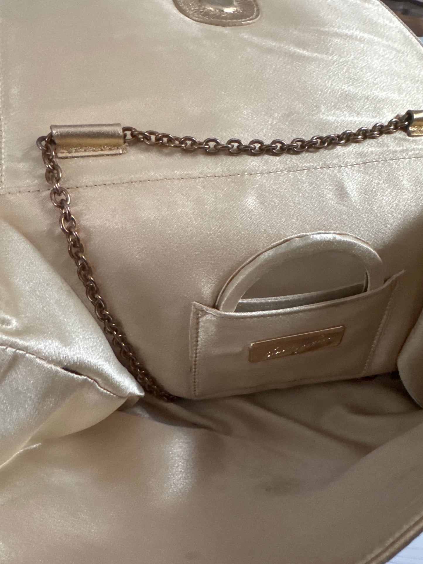 Beautiful 1970s signed Kenneth J Lane gold lambskin convertible clutch with two rhinestone tiger eyes
