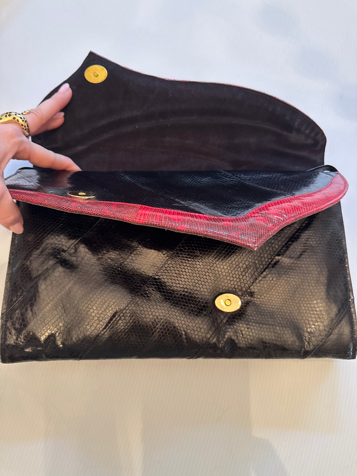 Absolutely, stunning, vintage snake skin clutch with optional shoulder strap in black and burgundy with two roomy compartments. Each compartment has its own zipper and small pocket