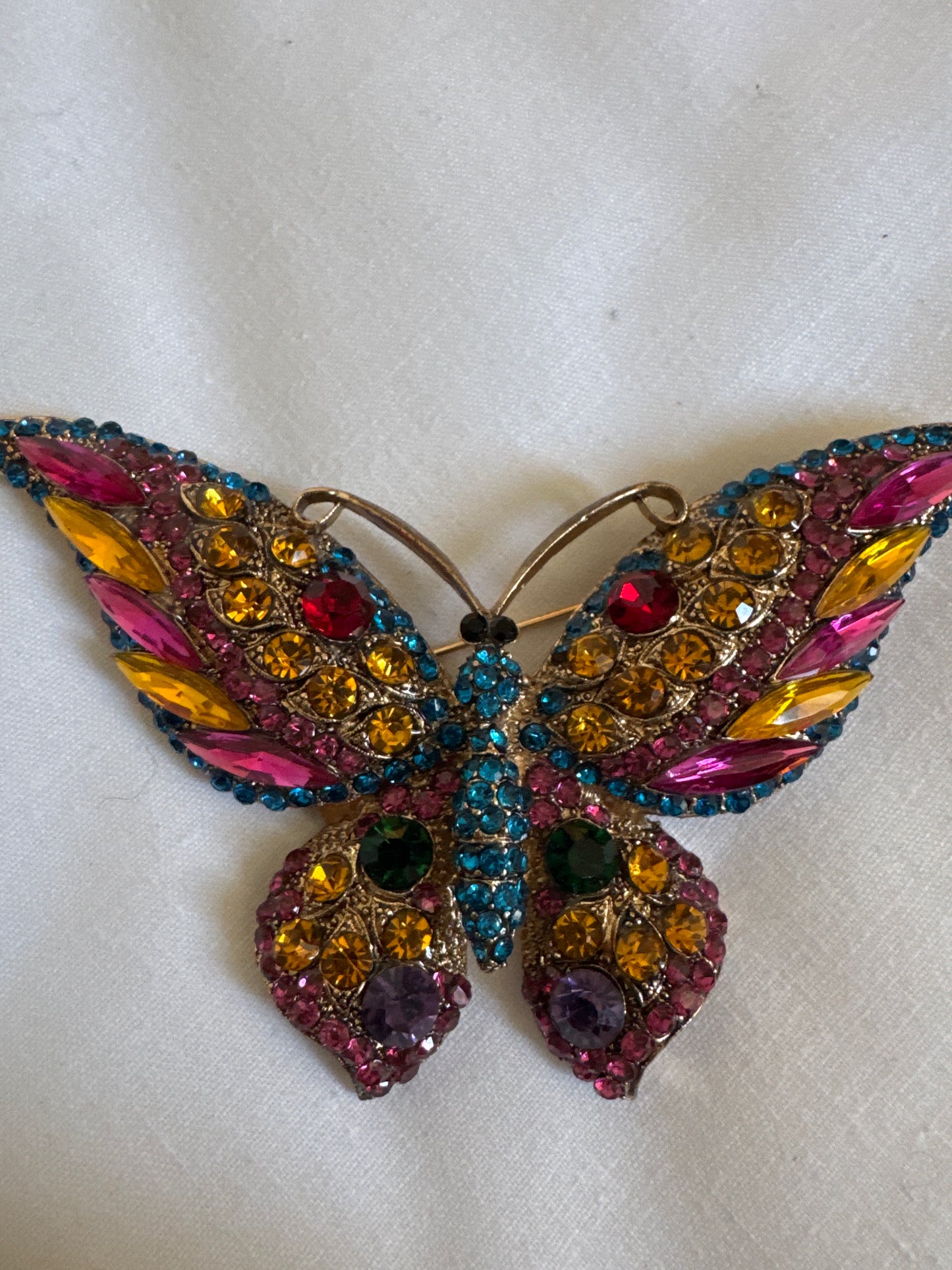 Vintage 1980s jumbo pink and blue rhinestone butterfly brooch. Sourced in Paris.