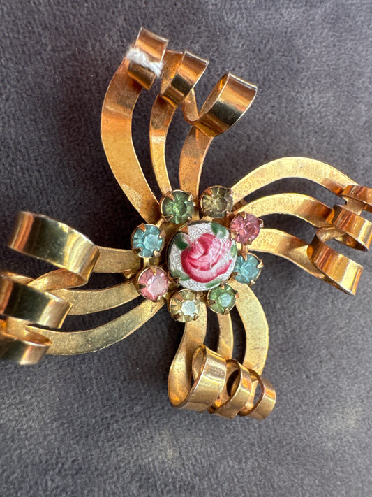 1940s gold tone and pastel rhinestone brooch with enamel rose in center