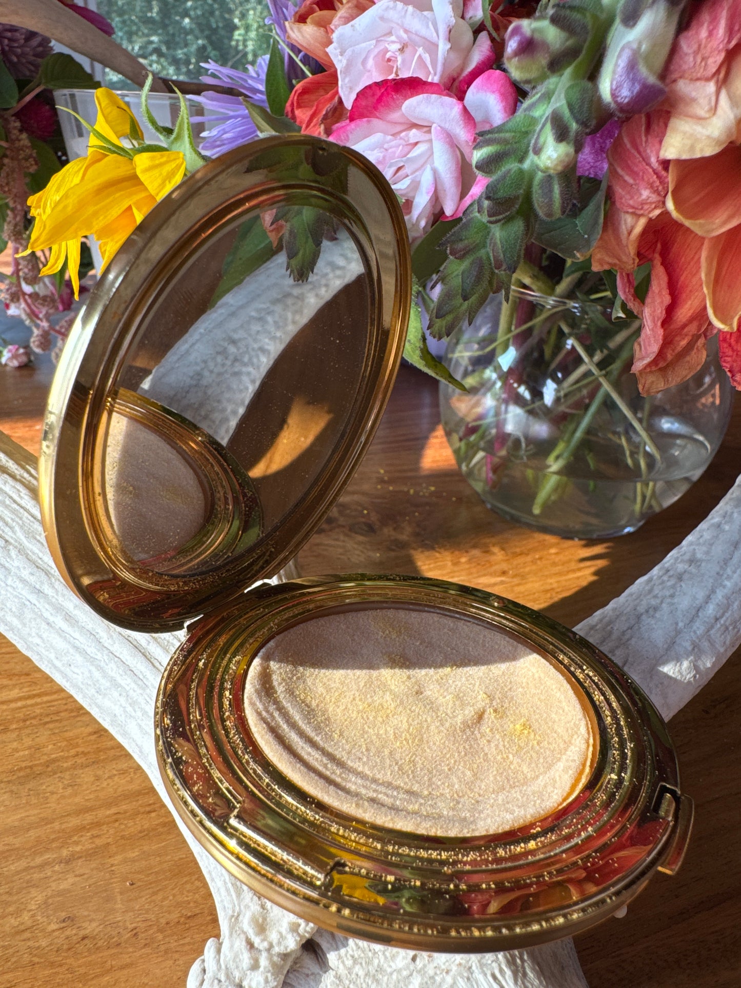 Beautiful signed STRATTON England, gold tone make up compact with black enamel rhinestone and white cabachon stone