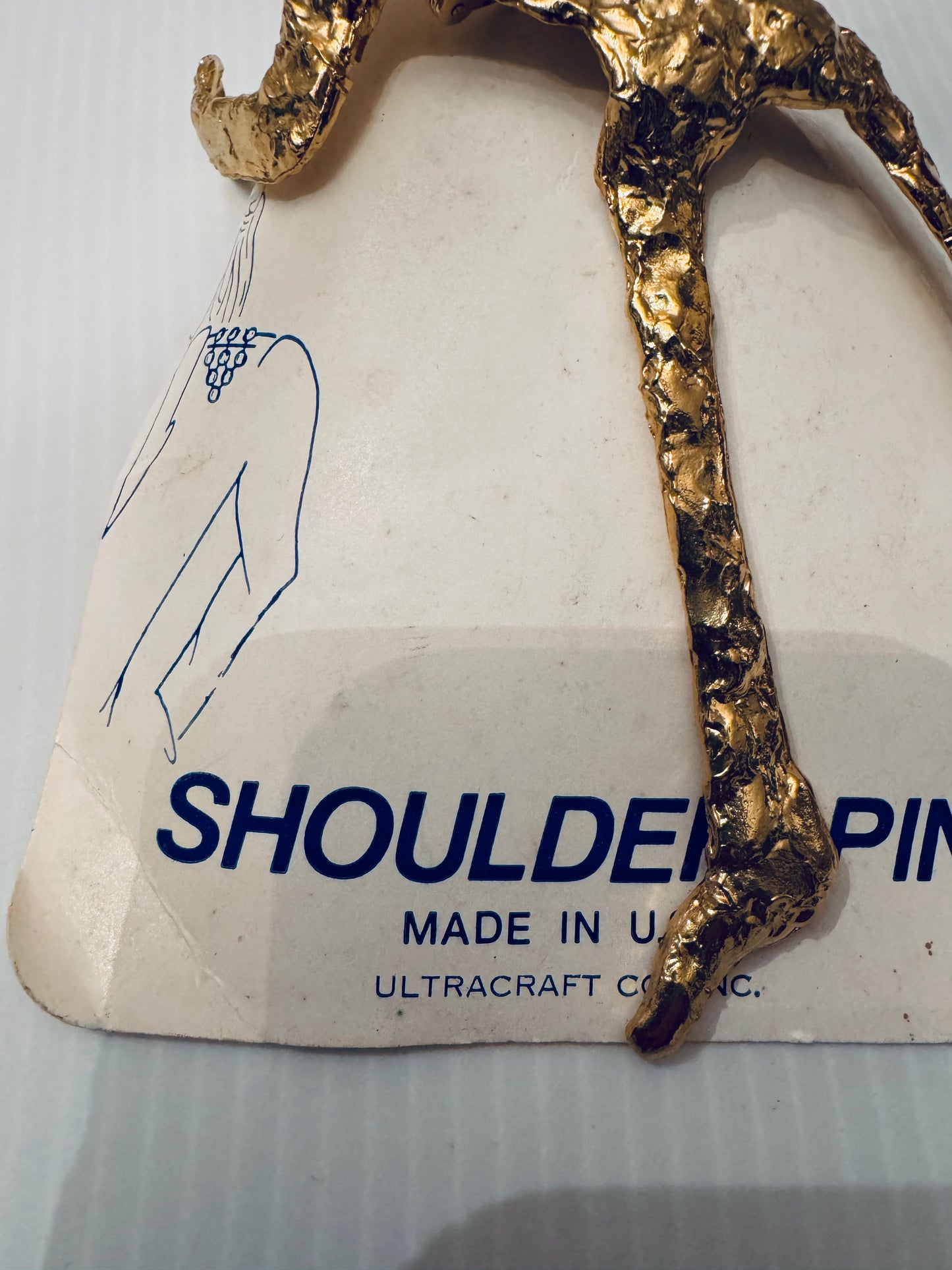 RARE gold tone crawling man shoulder brooch signed Ultracraft from the 70s with original packaging