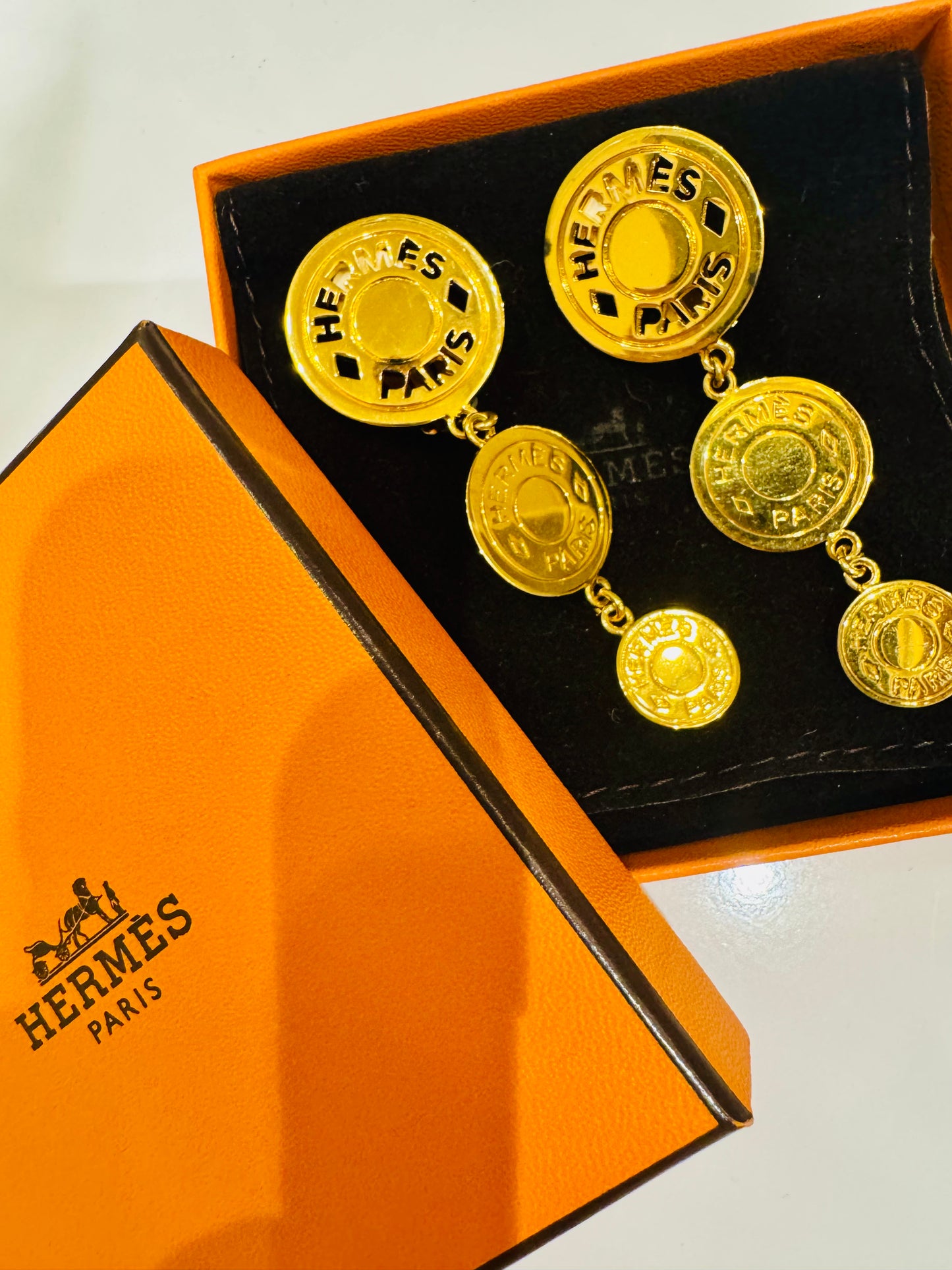 Vintage Hermes gold tone, three drop coin earrings