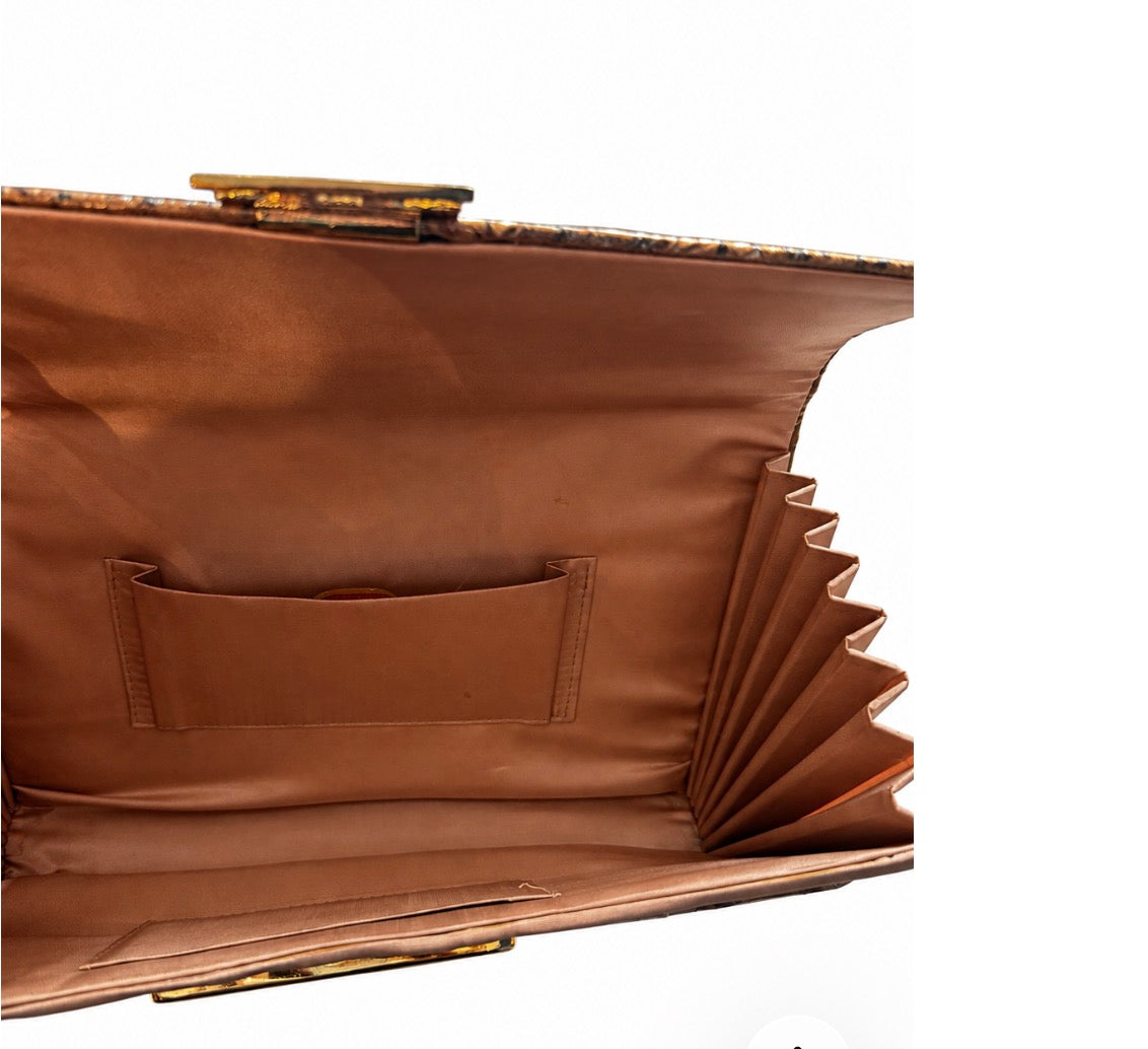 1980s vinyl ostrich feather clutch/top handle accordion bag with built in mirror