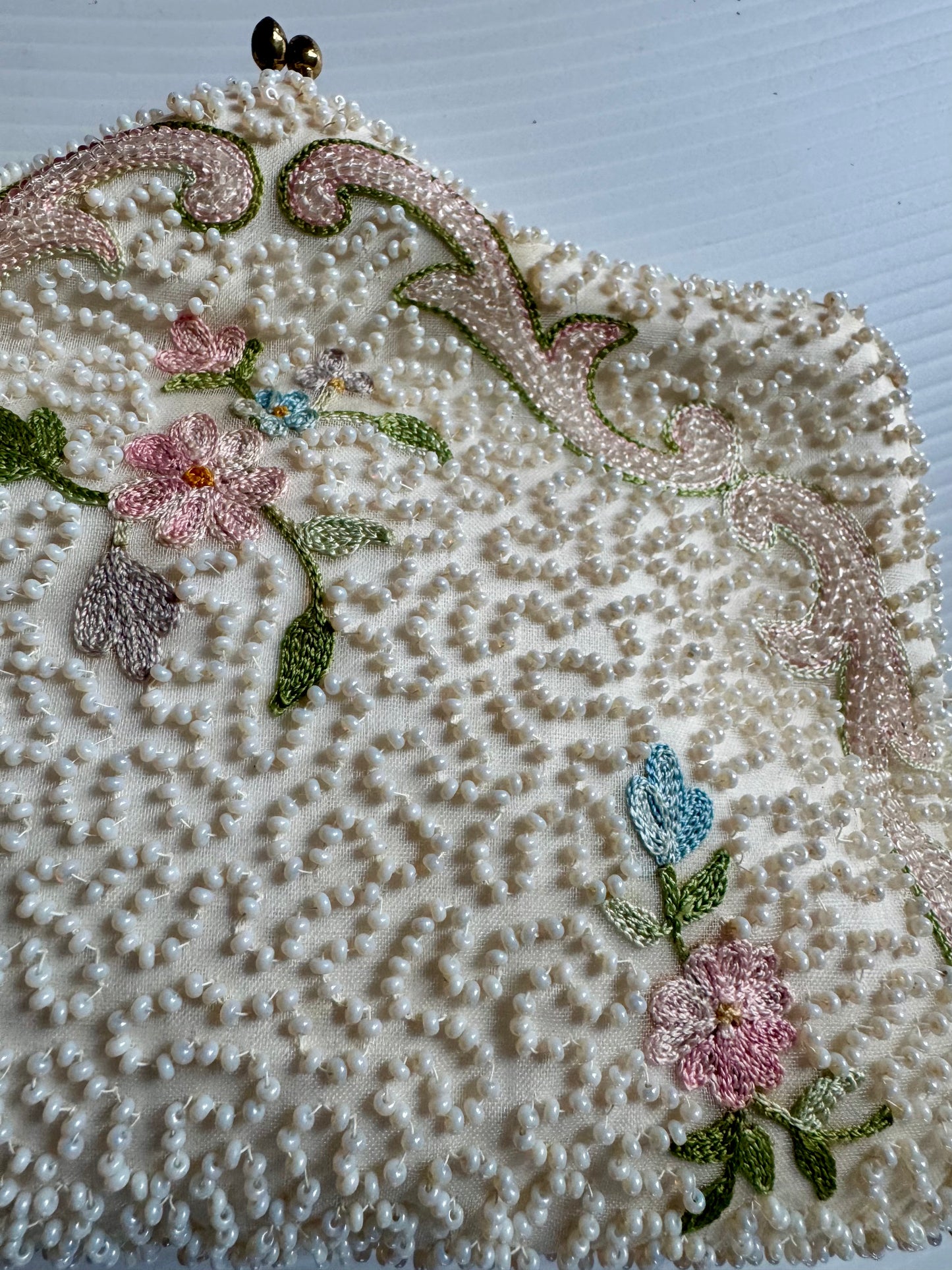 Stunning 1940s ivory beaded bag with small flowers. Sourced in Paris.