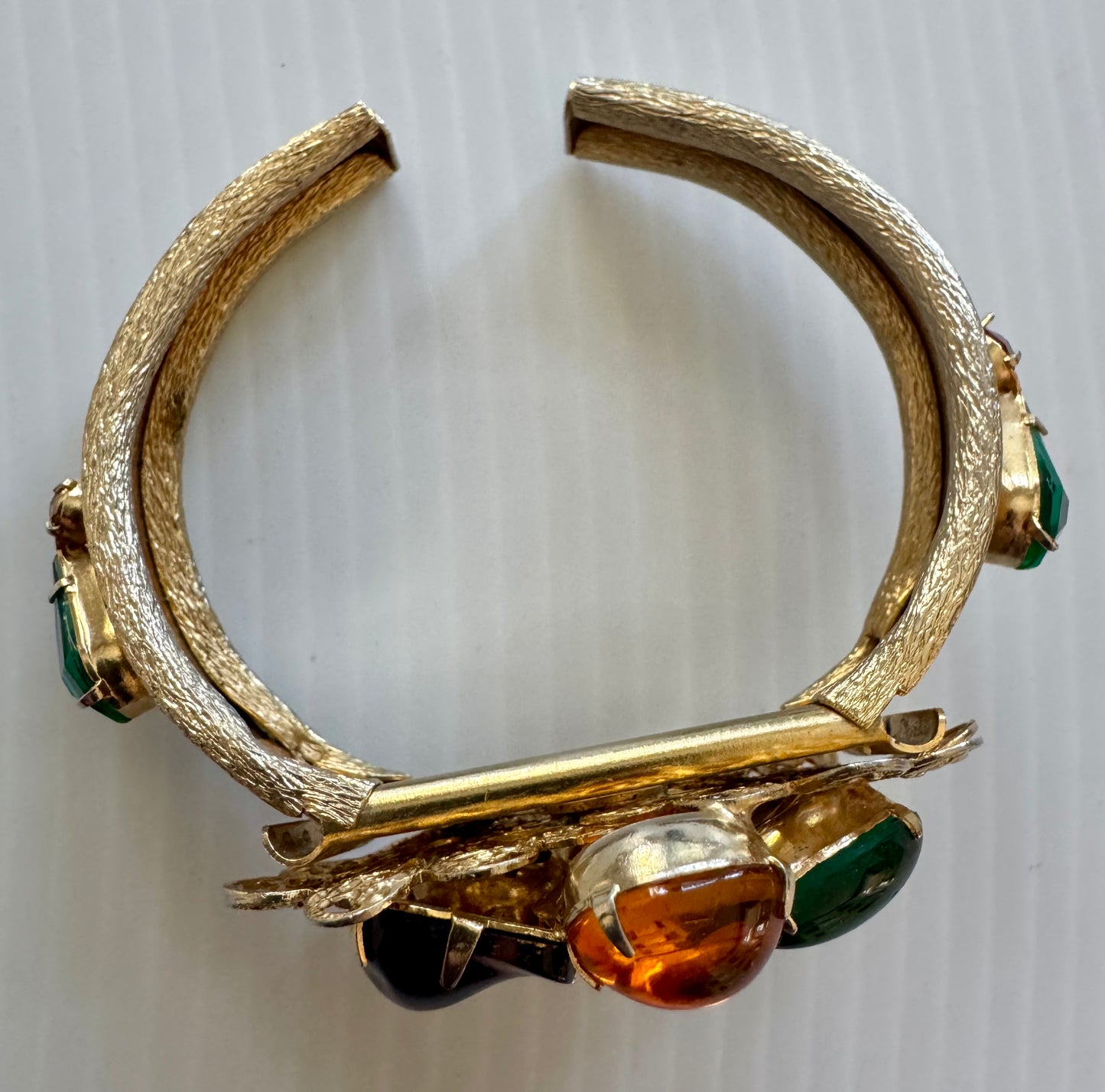gorgeous, gold tone, vintage clamper bracelet with multicolor rhinestones. Sourced in Paris.