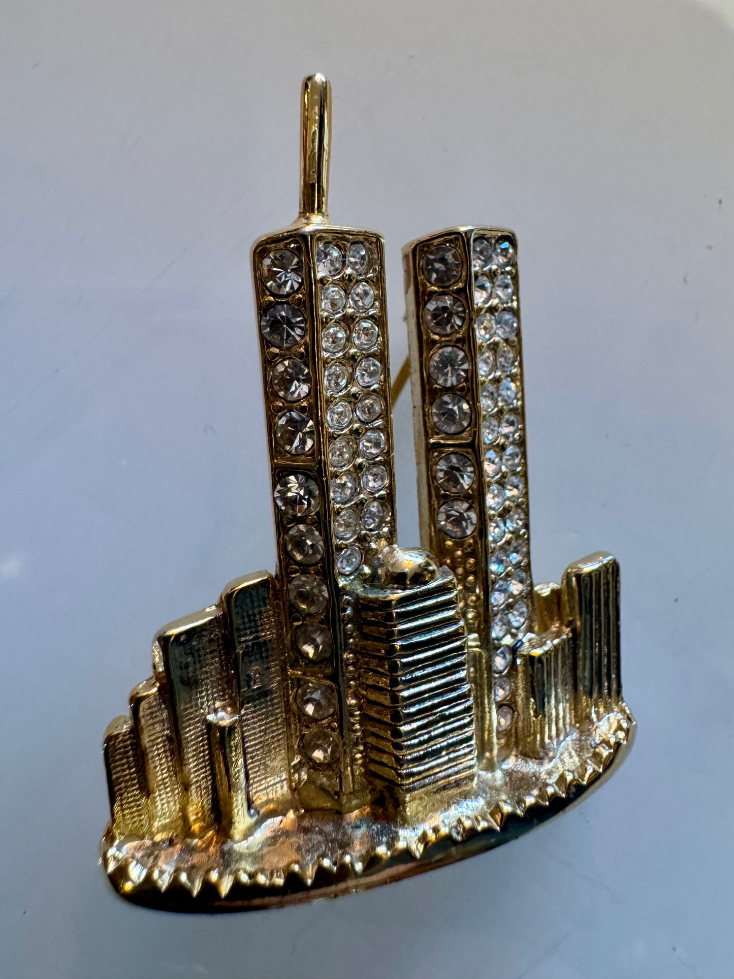 Twin Towers gold tone brooch with rhinestones