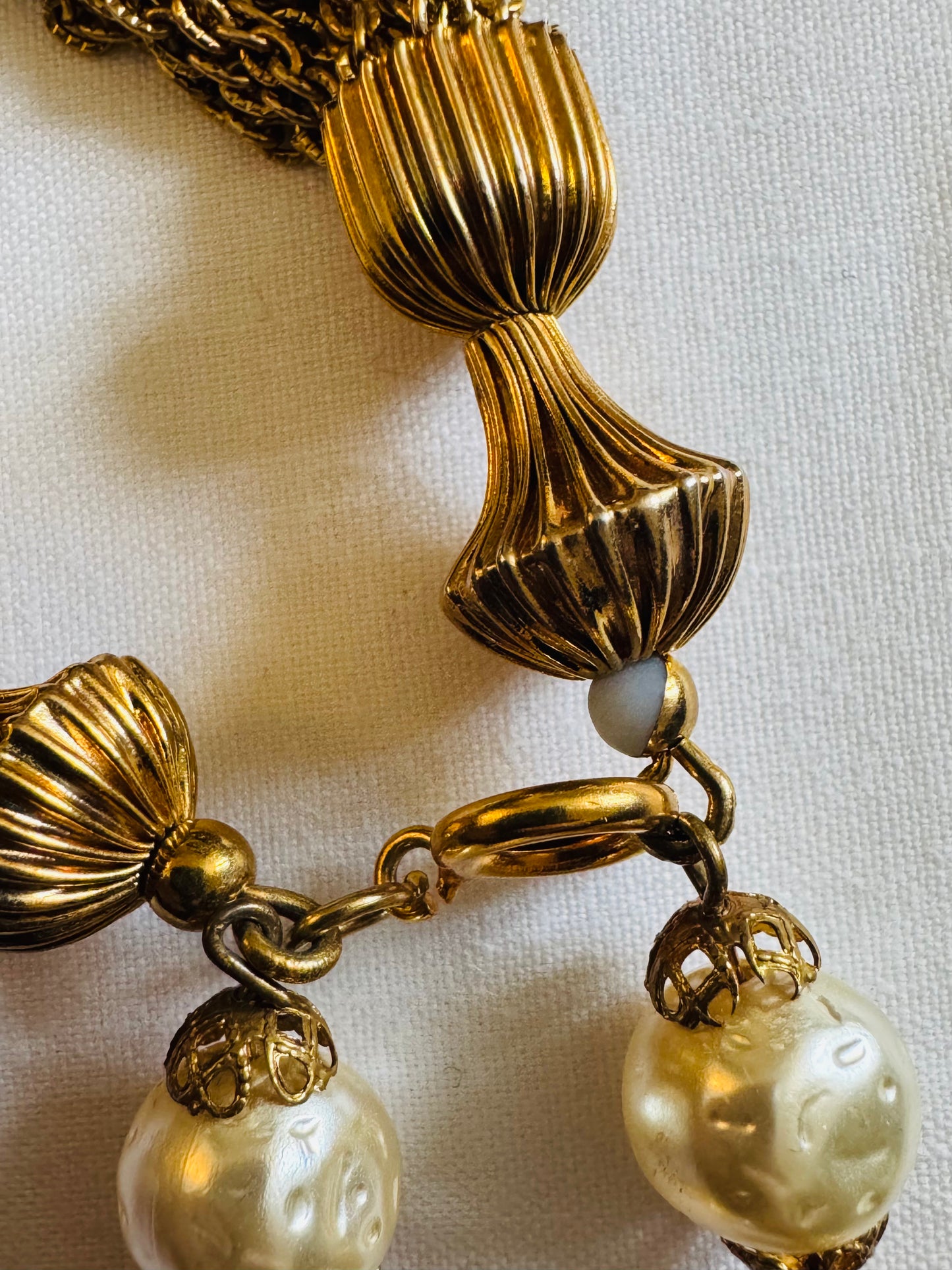 Gorgeous vintage Chanel inspired gold tone and pearl chain necklace. Tassel hangs down the back. Note some beads have chipped gold. Sourced in Paris.