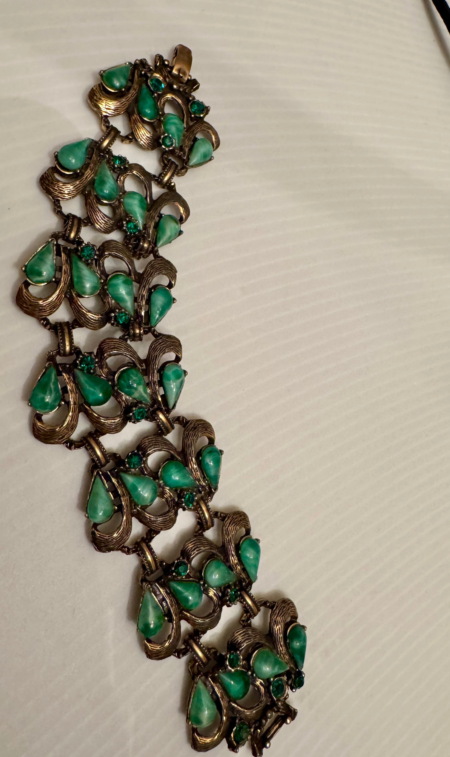 Beautiful chunky 1940s gold tone bracelet with green stones and rhinestones
