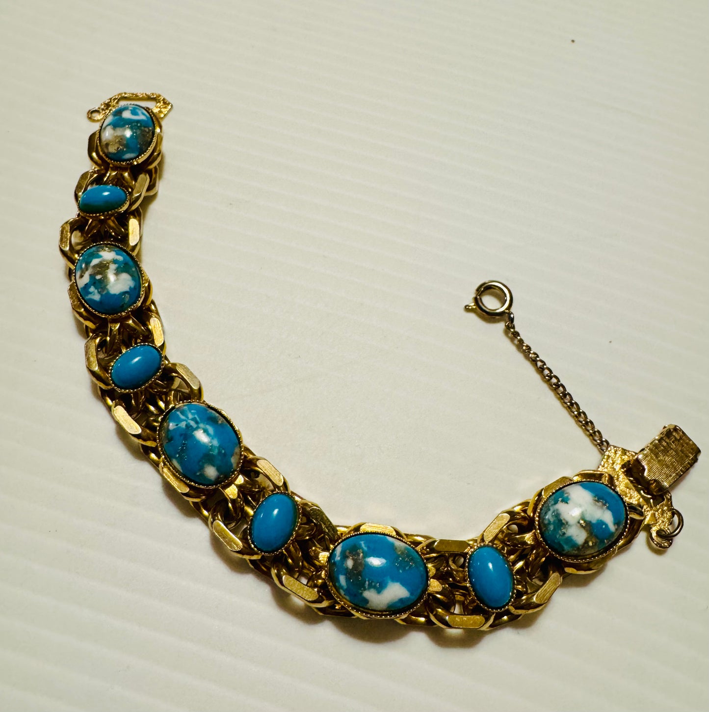 1960s gold tone and turquoise stone bracelet with safety latch