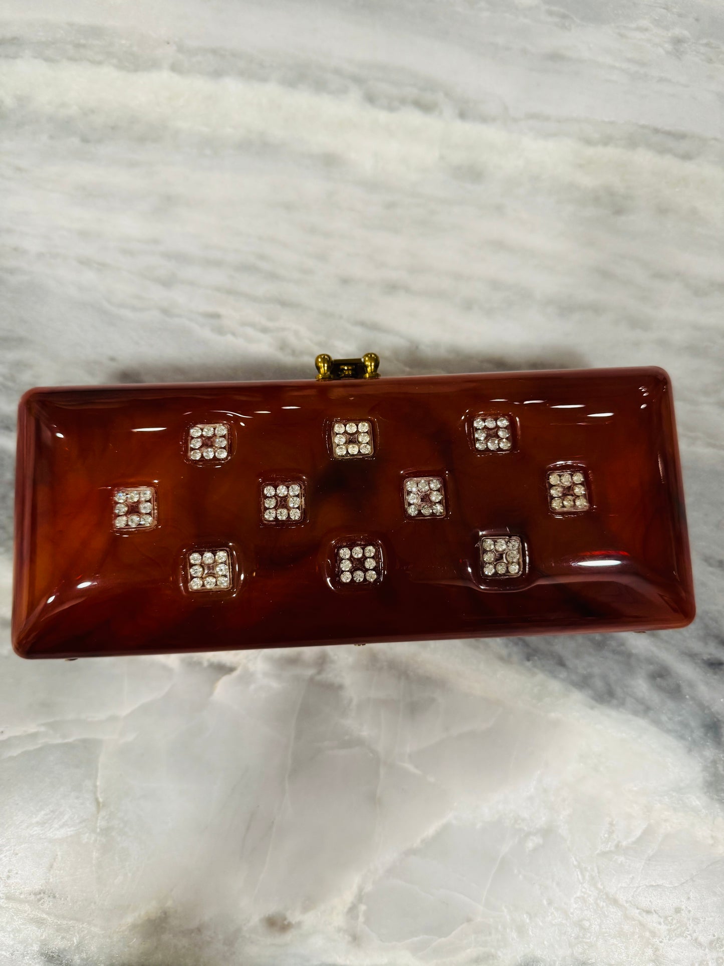 1940s tortoise lucite clutch with rhinestone detail (loose clasp 2 stones missing) Sold as is.