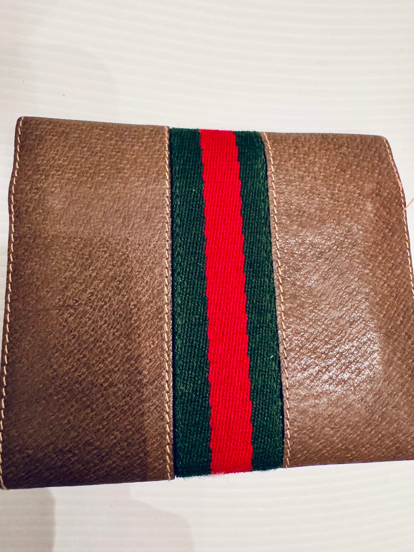 Vintage Gucci brown leather wallet with signature ribbon and gold horsebiy closure