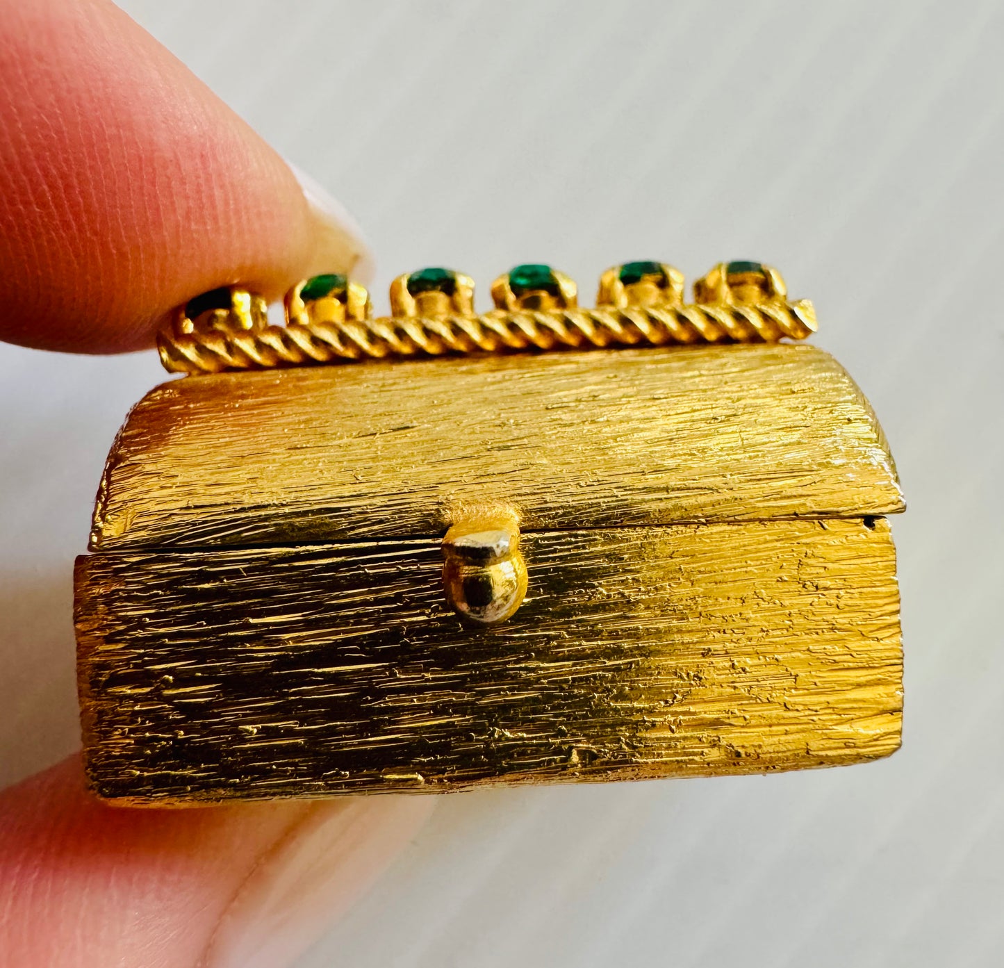 Stunning gold tone, mini trinket box with green rhinestones. sourced in Paris.