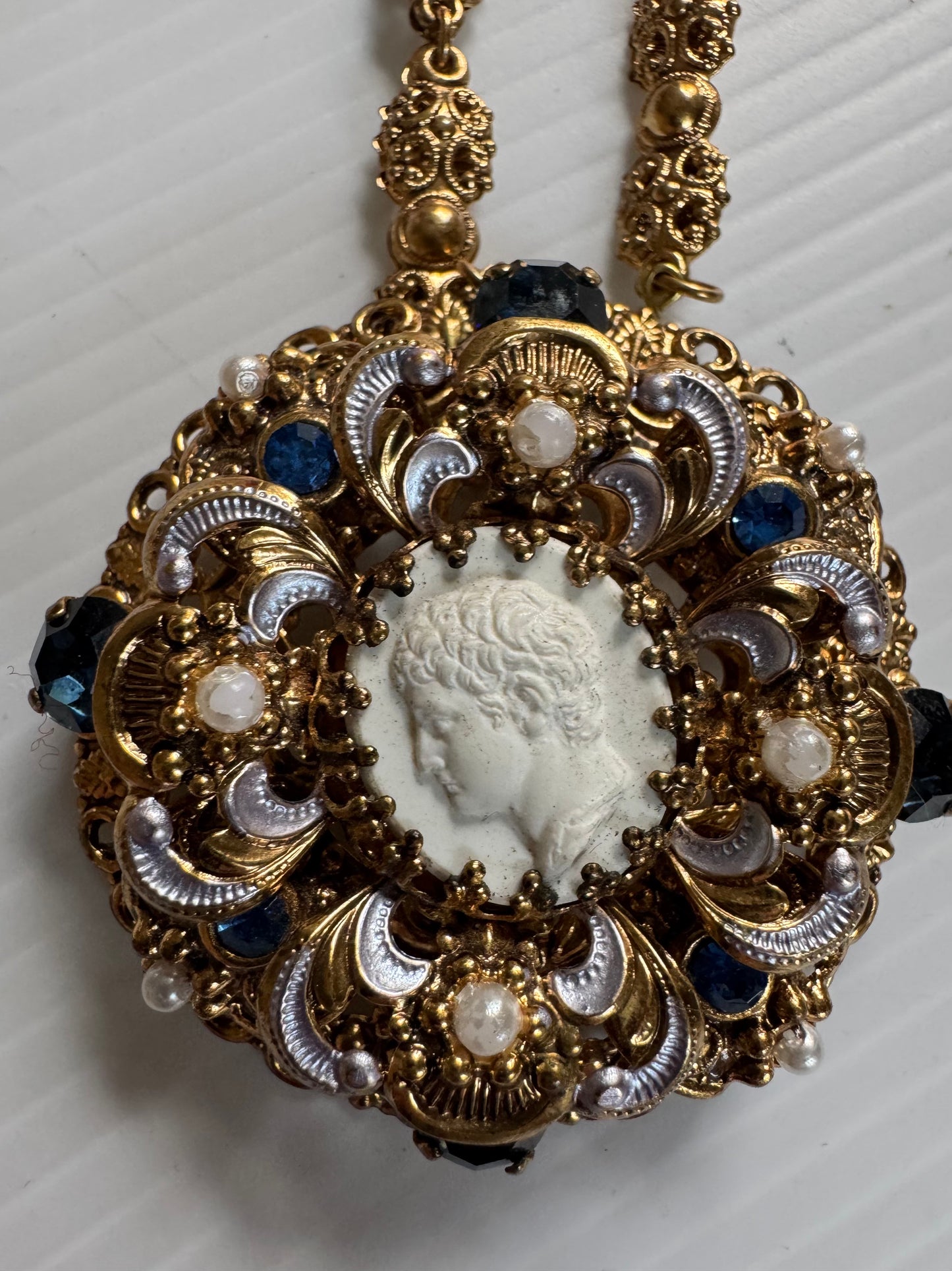 Gorgeous 1940s cameo necklace with pearl and rhinestone frame and delicate pearl closure. Sourced in Paris.