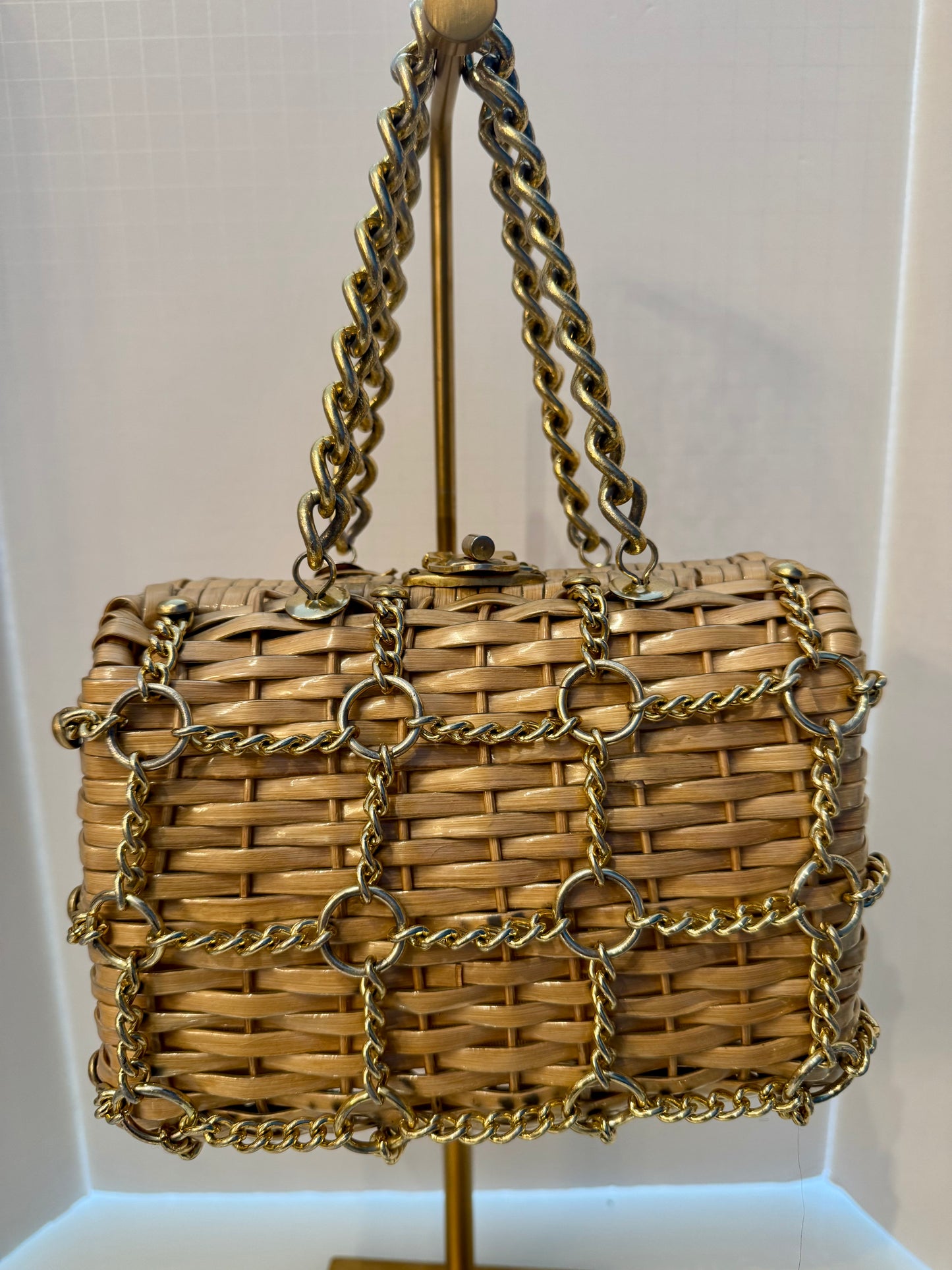 Beautiful 1950s wicker bag with gold chain decoration on front and gold hardware. Yellow fabric inside has some slight imperfection. Please see last photo Just a gorgeous piece.