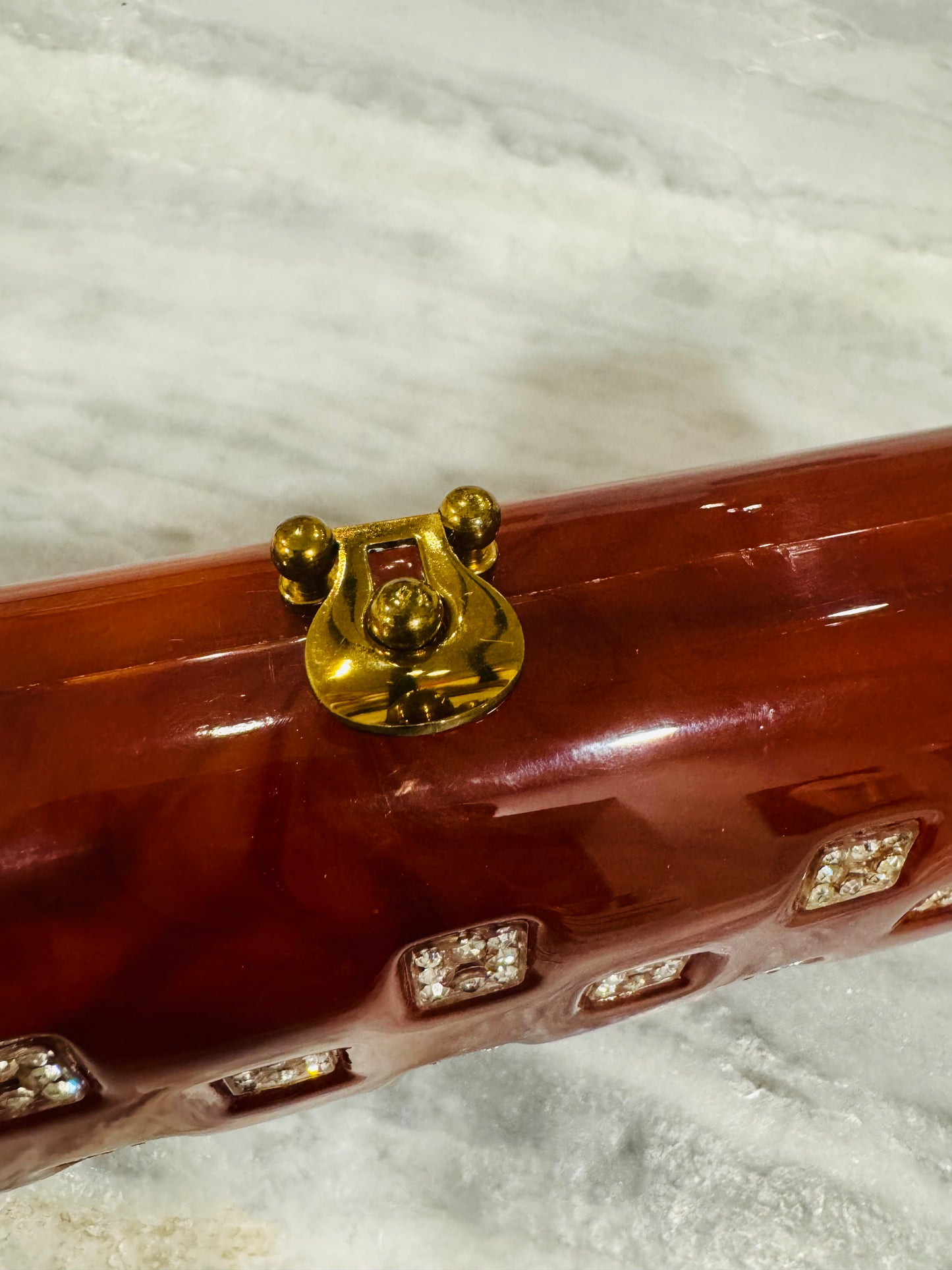 1940s tortoise lucite clutch with rhinestone detail (loose clasp 2 stones missing) Sold as is.