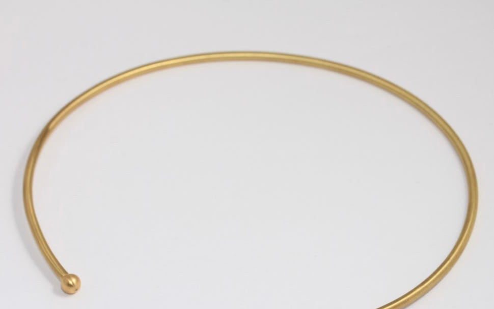 Wire choker in gold or silver, pick your color below. Perfect for adding a brooch or a pendant or wearing alone. Each purchase comes with a free brooch converter complements of VAVRA New York.