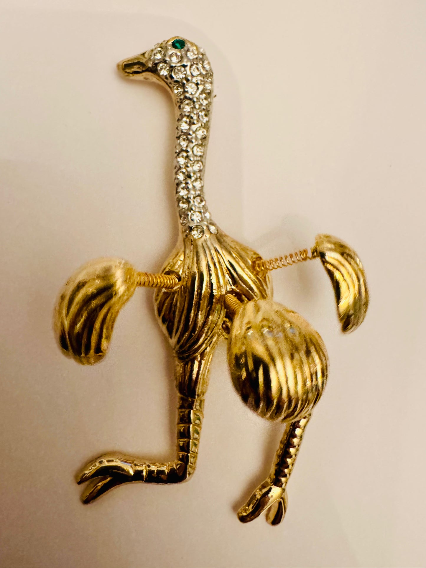 RARE adorable, vintage ostrich, brooch, gold tone with movable feathers on wire, rhinestone, face, and green rhinestone eye