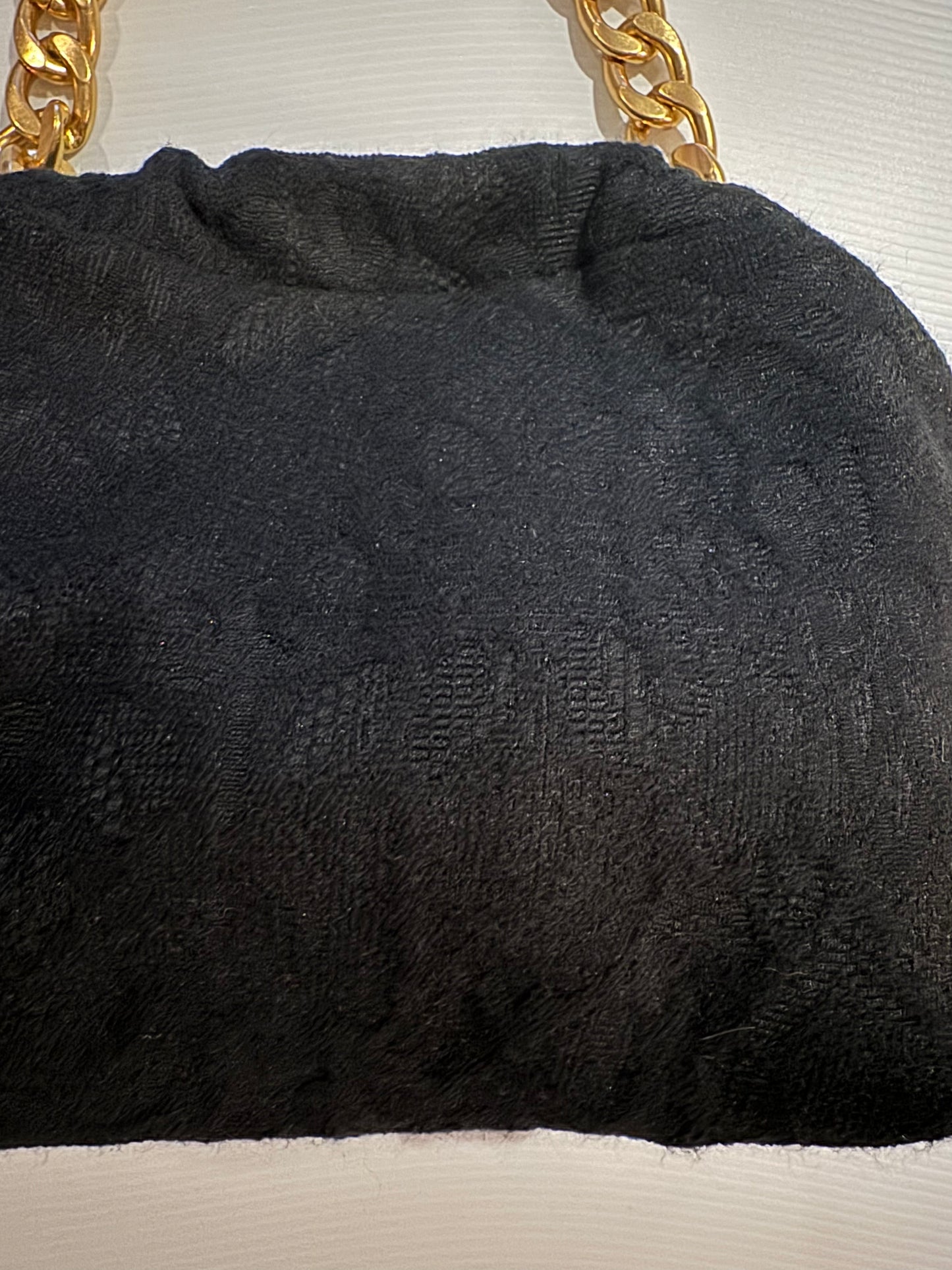 Exclusive Limited Edition Vavra New York black brocade bag. Converts from clutch to shoulder strap with chunky chain shown. Black lining with interior pocket.