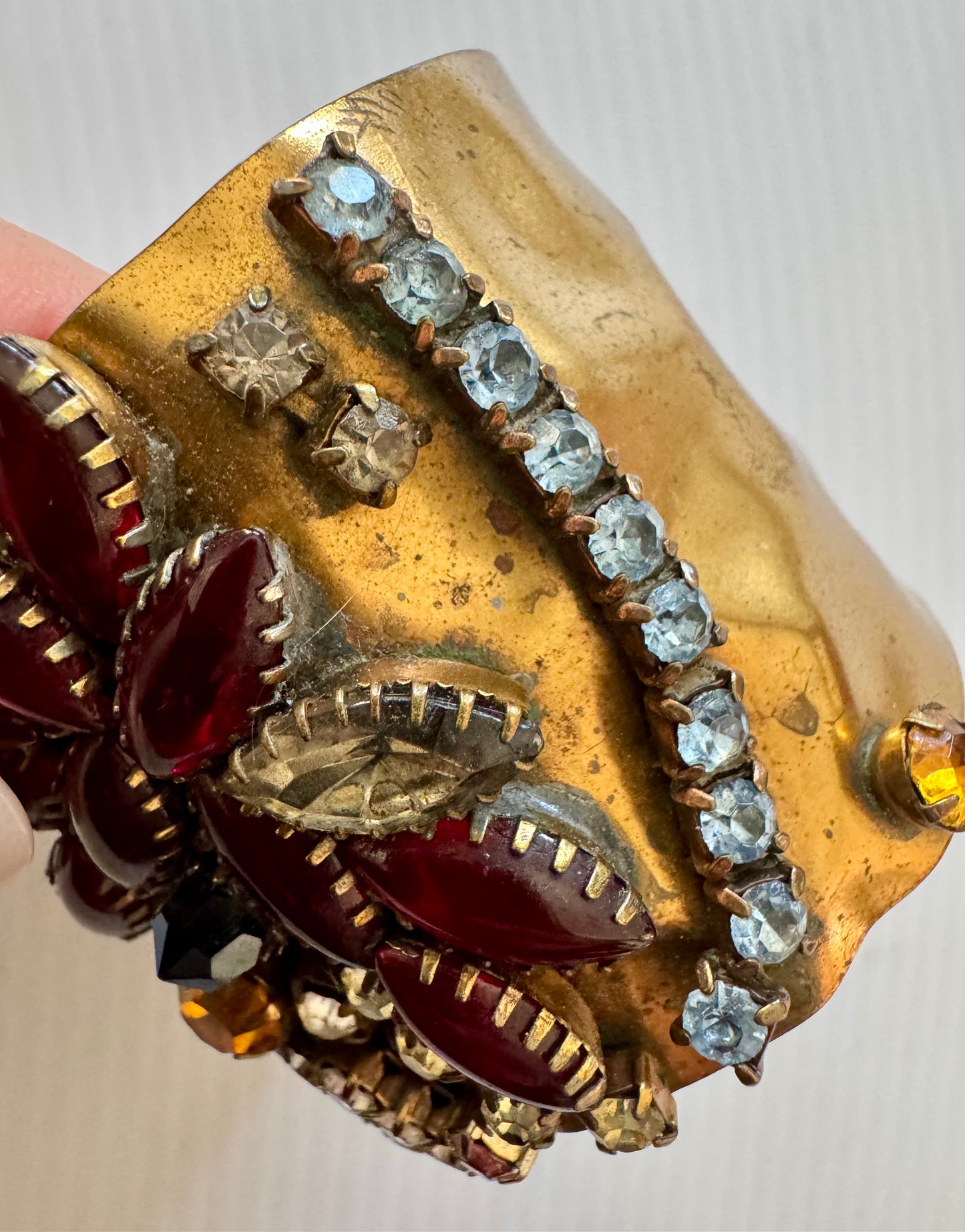 gorgeous vintage hammered cuff bracelet with multicolor rhinestones. Sourced in Paris.