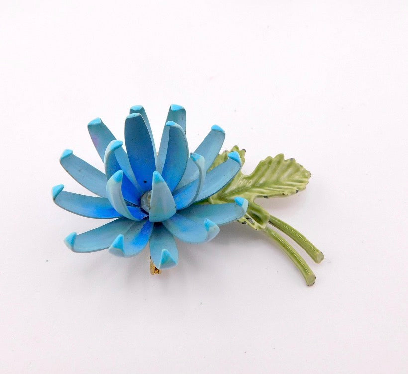 1960s Vintage Enameled Flower Power Brooch.
Two Layered Petals, Shades of Blue and Green Enamel with Clear Rhinestone Center.