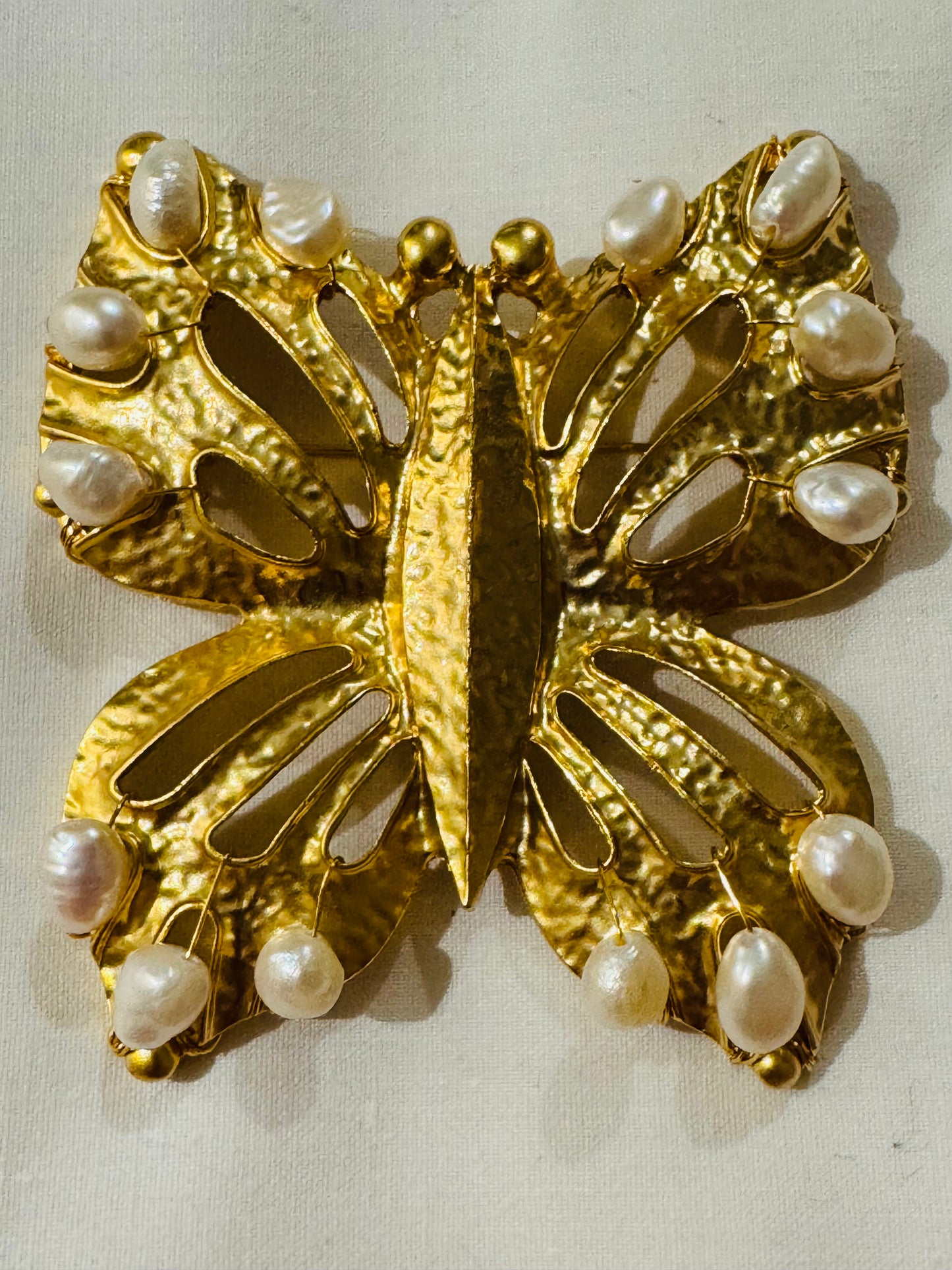 Vintage 1980s oversized butterfly gold tone brooch with pearls. Sourced in Paris.