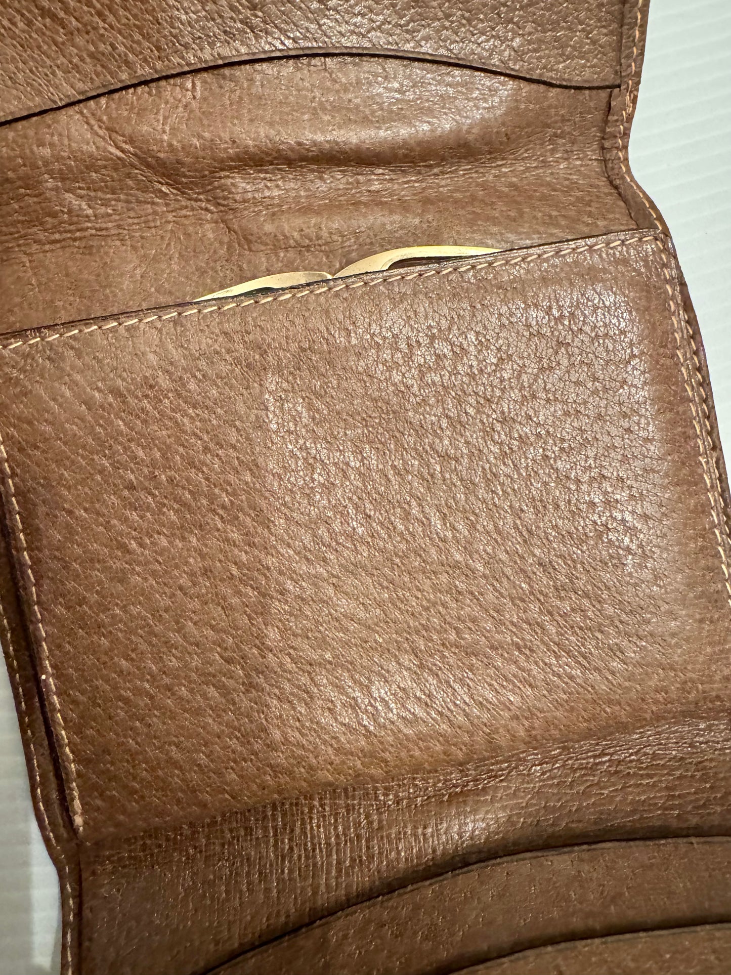 Vintage Gucci brown leather wallet with signature ribbon and gold horsebiy closure