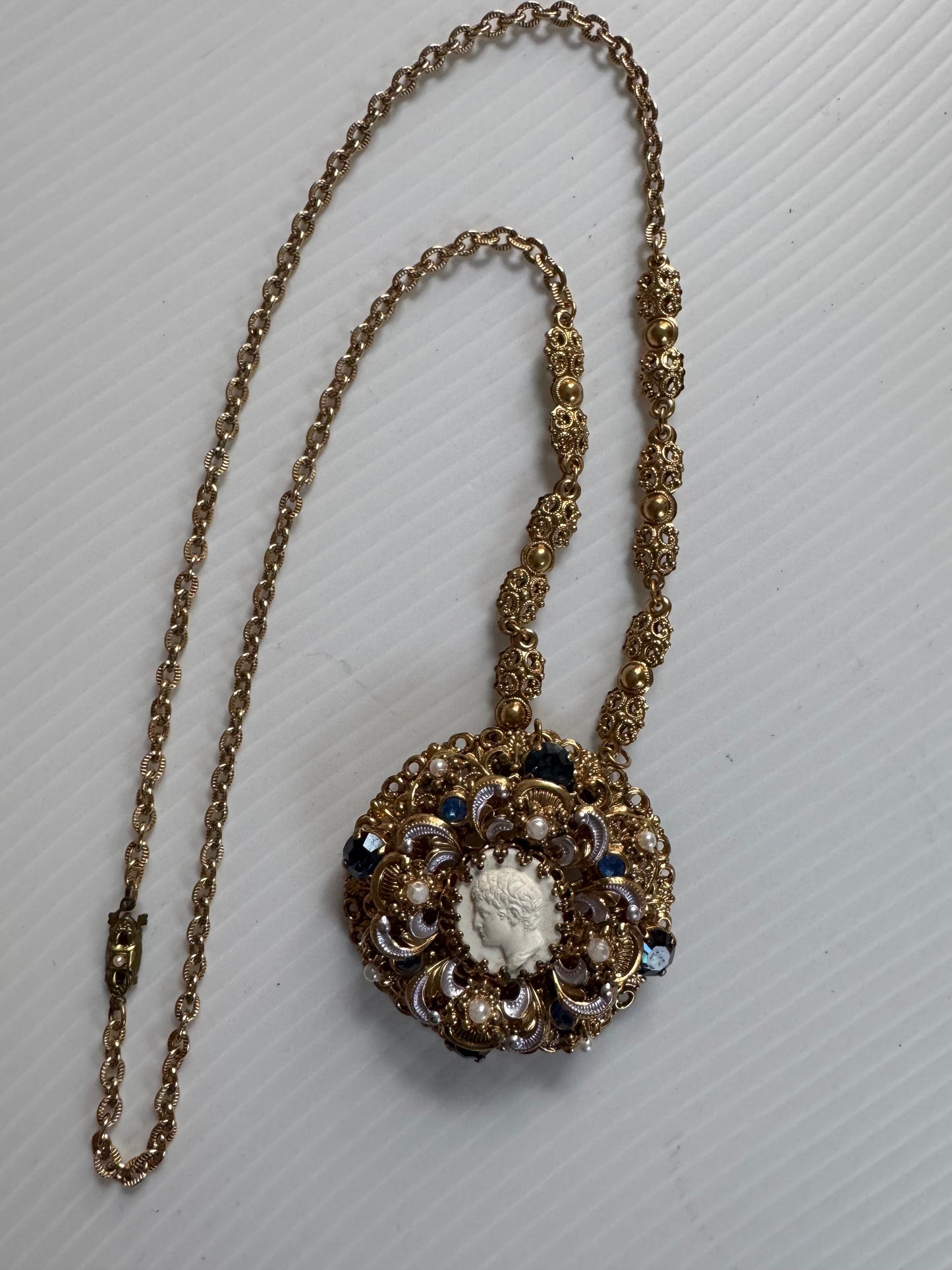 Gorgeous 1940s cameo necklace with pearl and rhinestone frame and delicate pearl closure. Sourced in Paris.