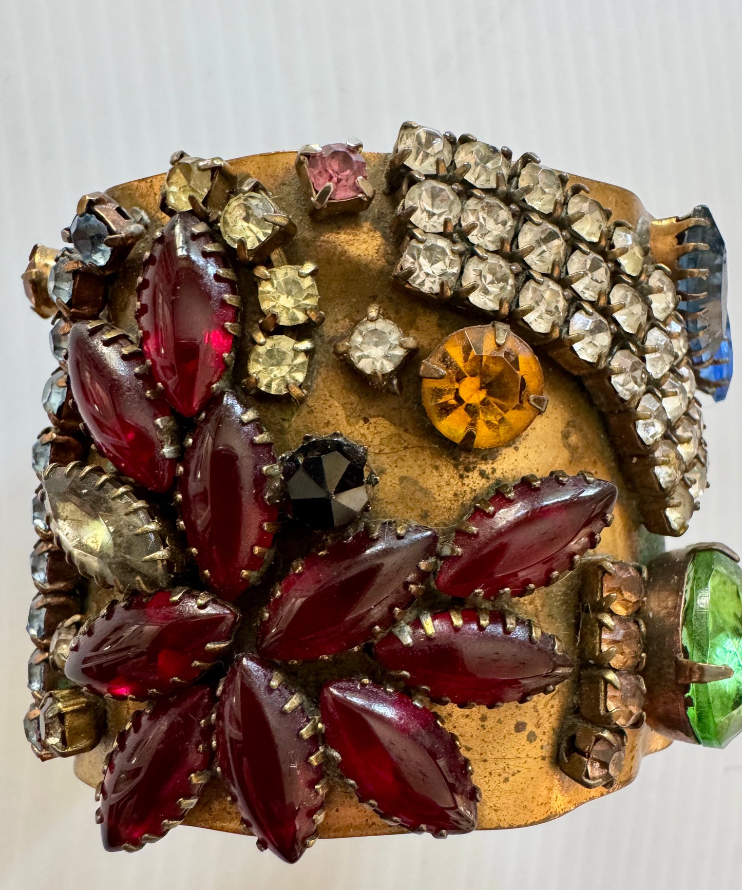 gorgeous vintage hammered cuff bracelet with multicolor rhinestones. Sourced in Paris.