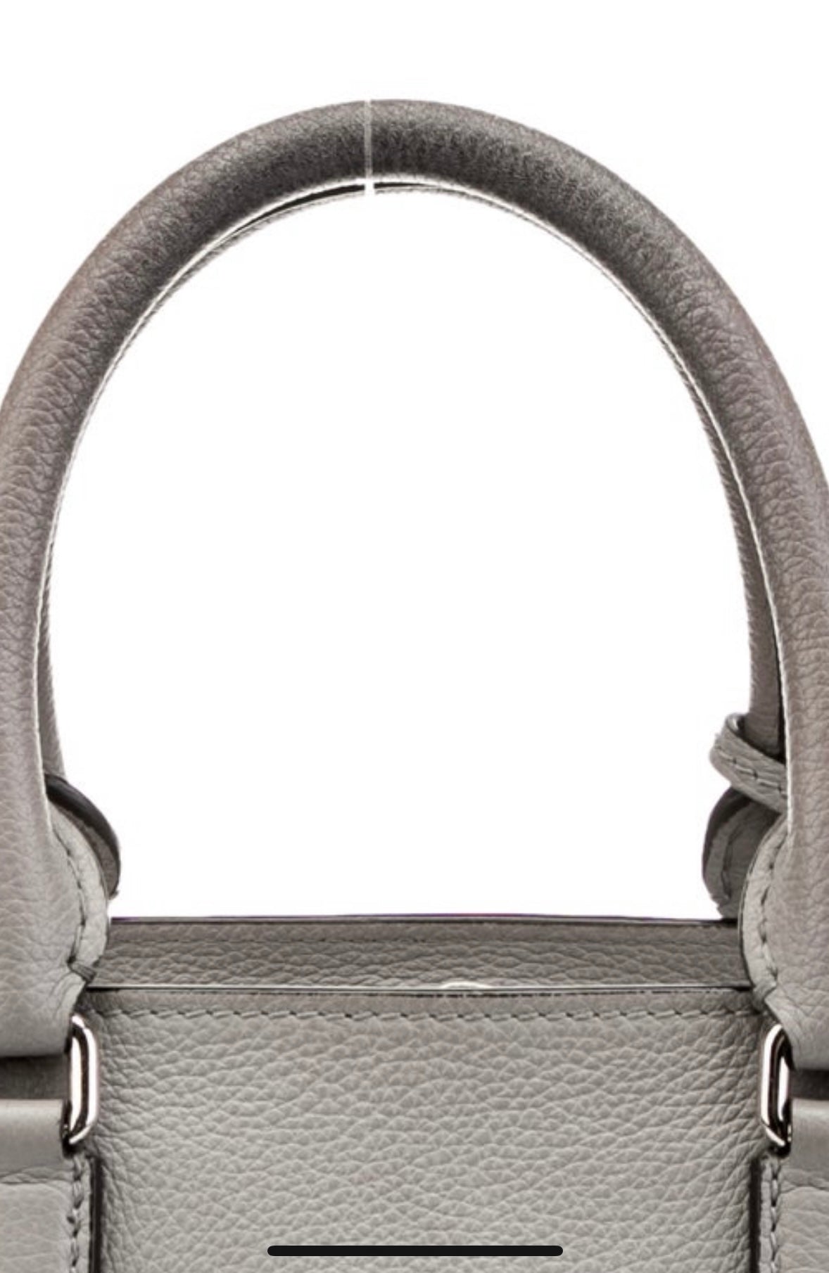 Vintage Alexander McQueen grey leather top-handle handbag with signature silver tone skull charm.