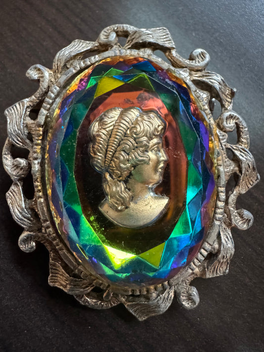 Beautiful cameo with multicolor reflective stone on silver tone brooch