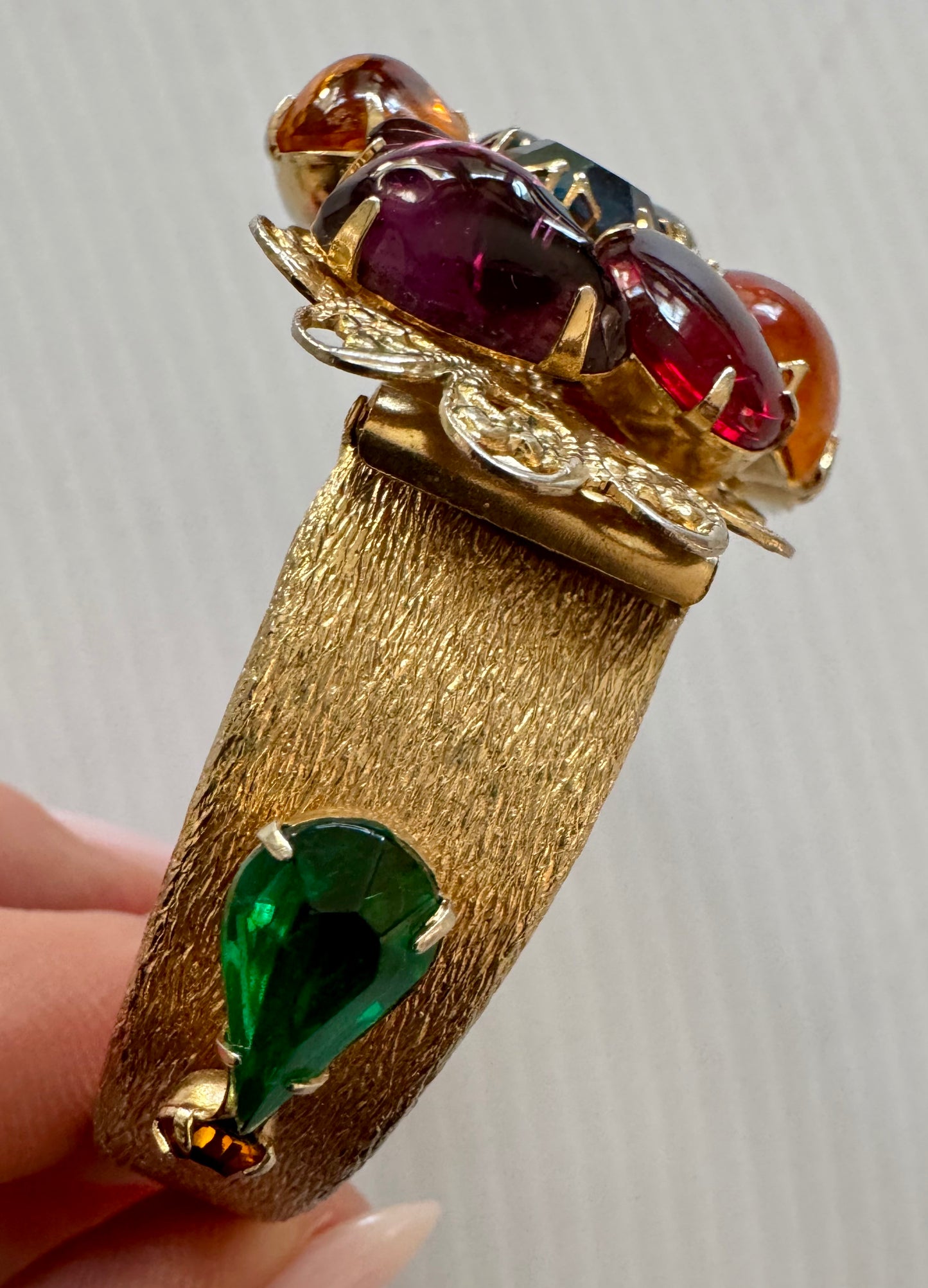 gorgeous, gold tone, vintage clamper bracelet with multicolor rhinestones. Sourced in Paris.