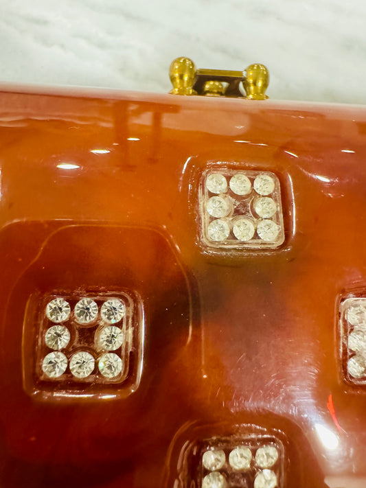 1940s tortoise lucite clutch with rhinestone detail (loose clasp 2 stones missing) Sold as is.