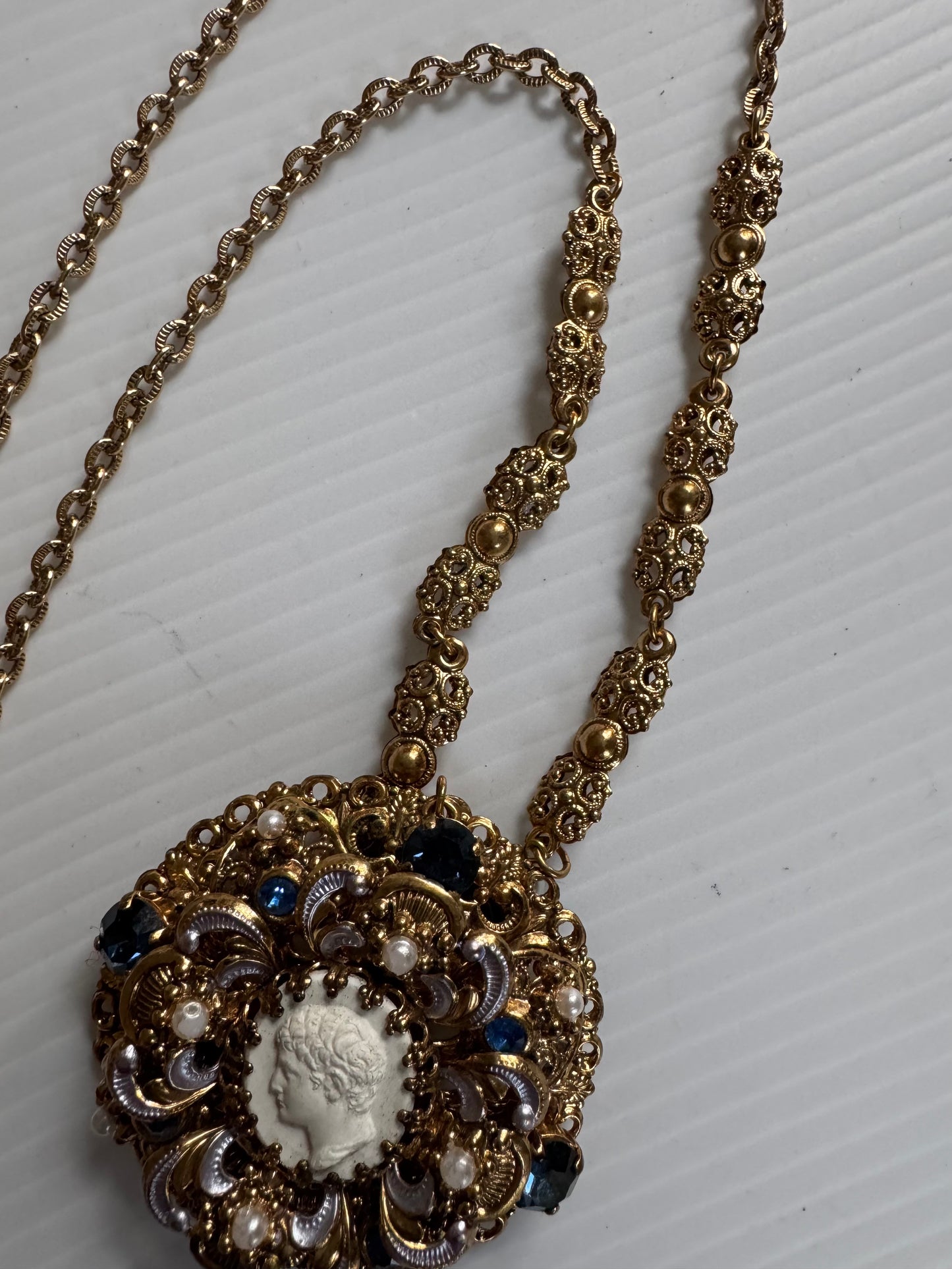 Gorgeous 1940s cameo necklace with pearl and rhinestone frame and delicate pearl closure. Sourced in Paris.