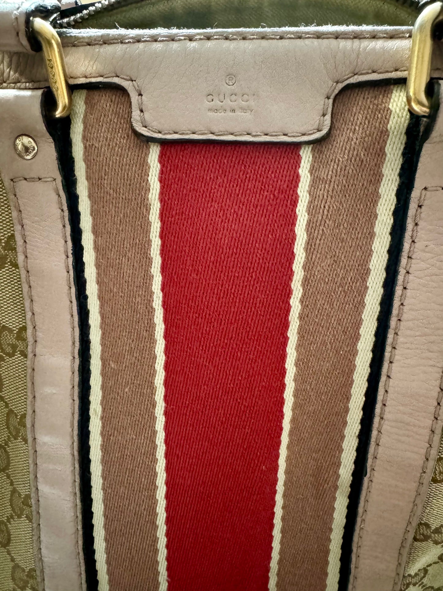 Gucci Boston Bag with leather handles and crossbody strap. 3 interior pockets.