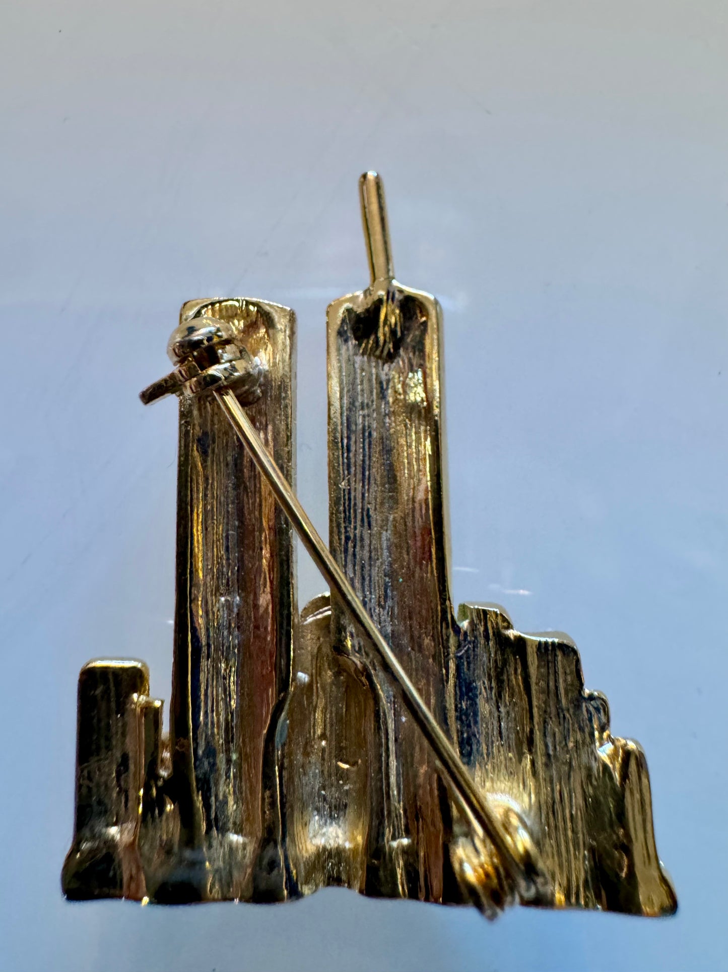 Twin Towers gold tone brooch with rhinestones