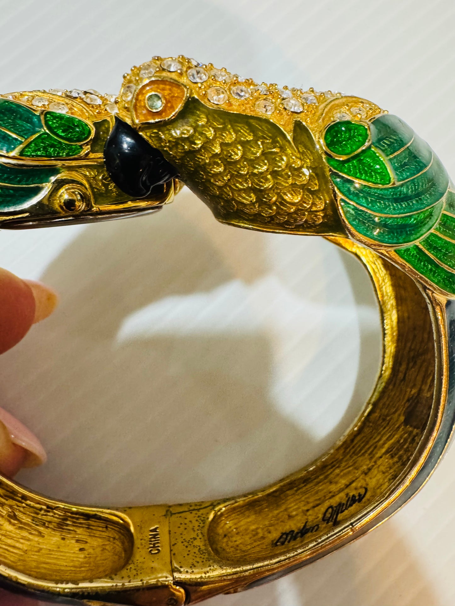 Amazing rare vintage signed Nolan Miller, enamel and rhinestone parrot, clock clamper bracelet