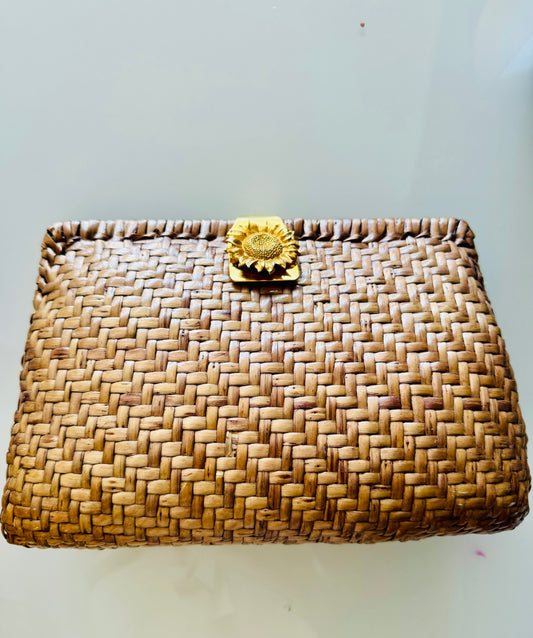 Natural shade raffia clutch with gold tone sunflower clasp