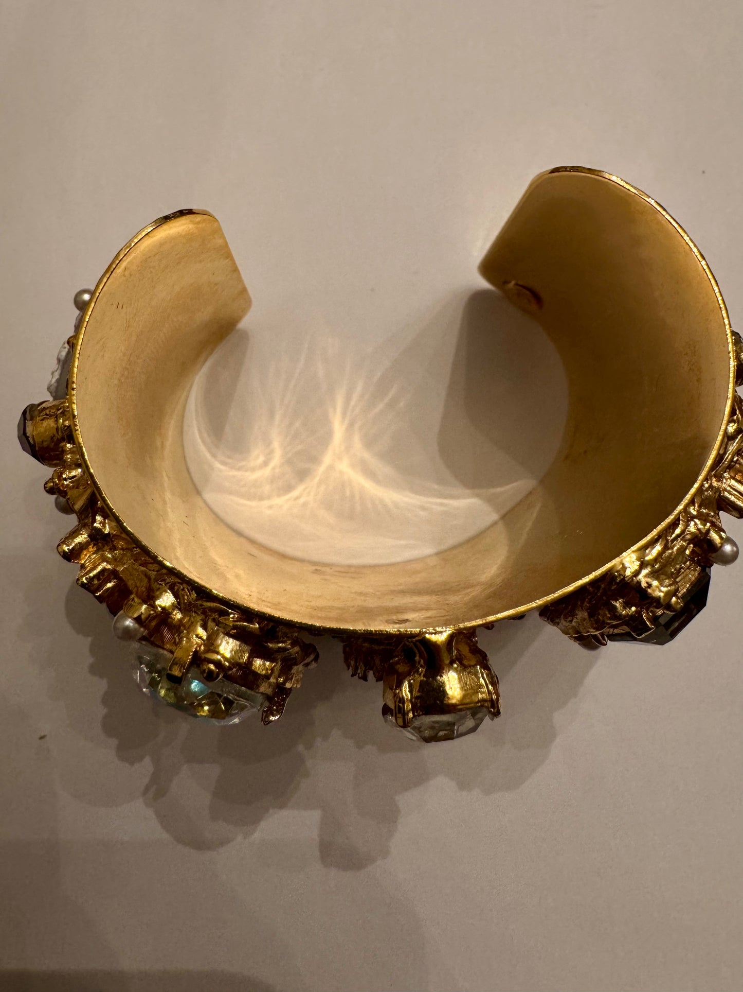 1980s incredible vintage cameo bracelet on hammered gold tone cuff, featuring rhinestones, aurora borealis and faux pearls